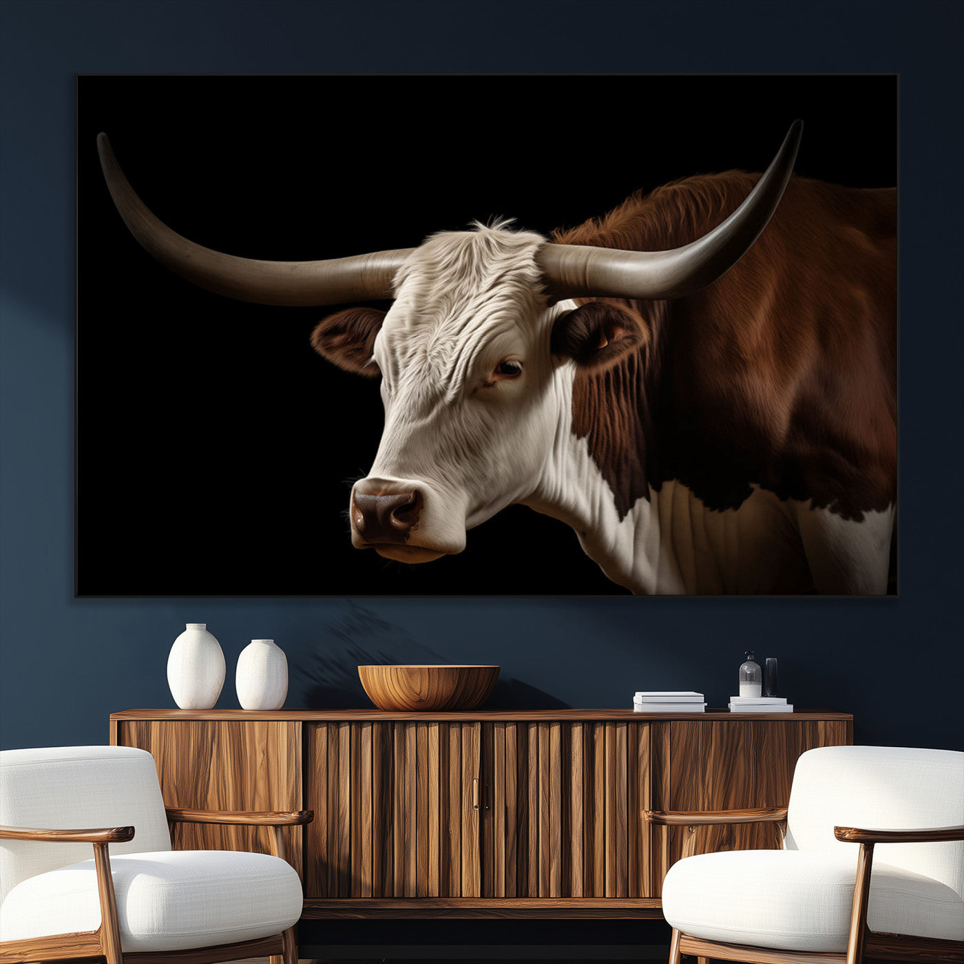 "Close-up of a brown and white longhorn cow with prominent curved horns against a black background."