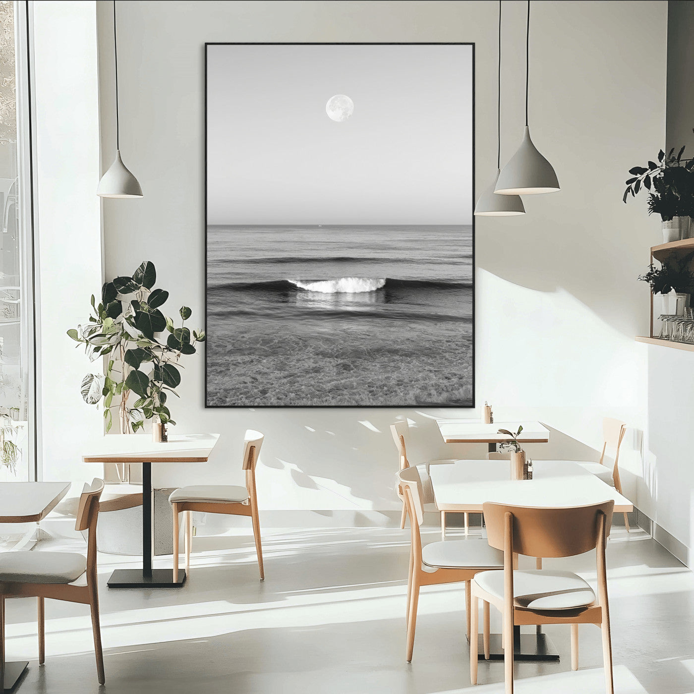 Black and white wall art of a calm ocean wave beneath a full moon, ideal for minimalist or monochrome coastal decor.