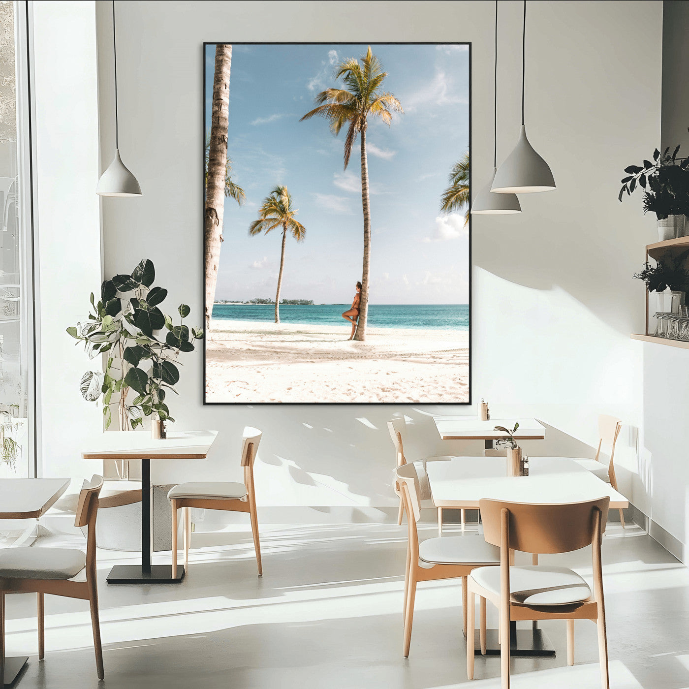 Person leaning on a palm tree at a tropical beach with white sand and turquoise water, perfect for coastal or beach-themed home decor.