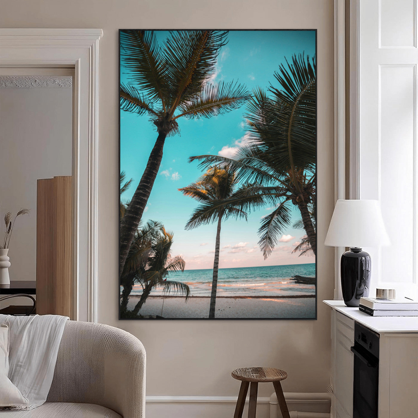 Tall palm trees swaying over a tropical beach with turquoise ocean waves and a soft sunset glow, creating a relaxing coastal vibe.