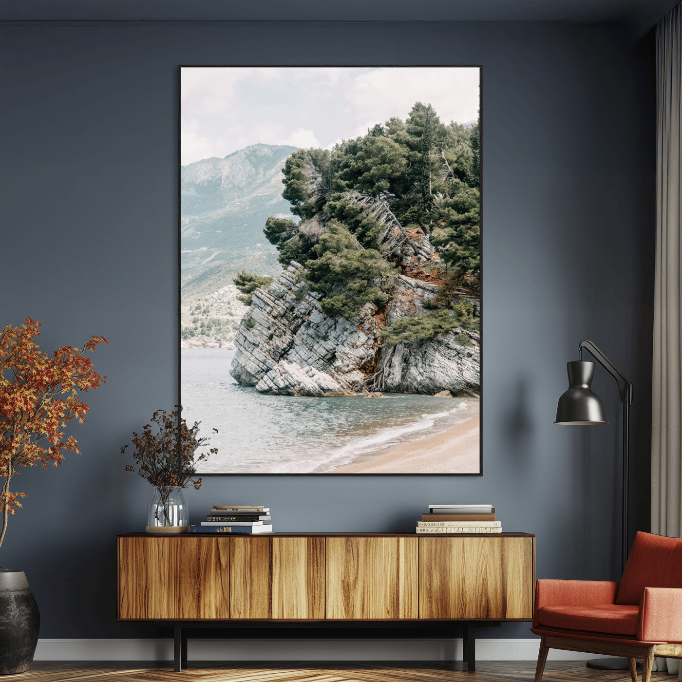 Framed photo of a rocky coastal cliff with dense greenery and calm shoreline, ideal for rustic coastal or earthy-toned home decor.