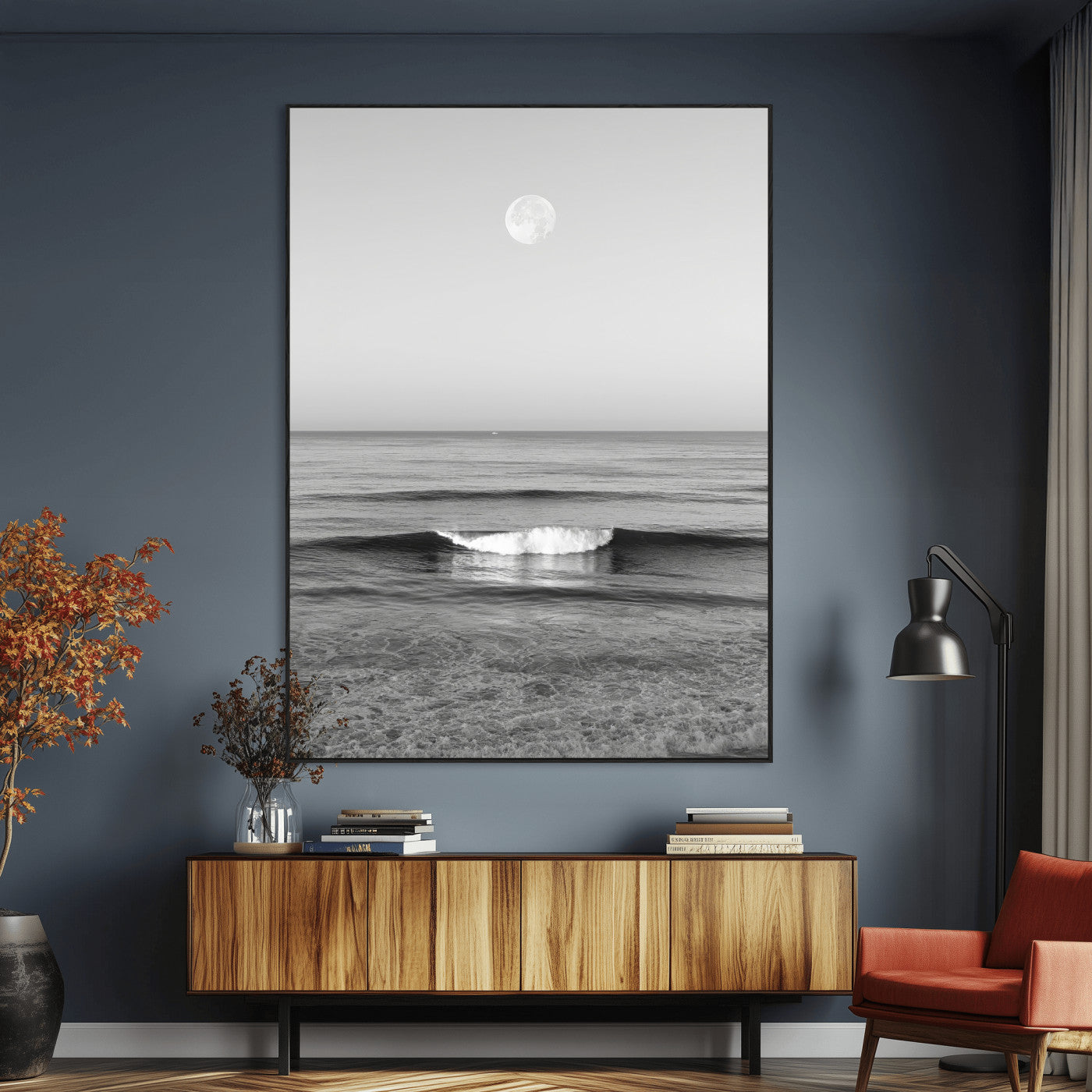 Black and white wall art of a calm ocean wave beneath a full moon, ideal for minimalist or monochrome coastal decor.