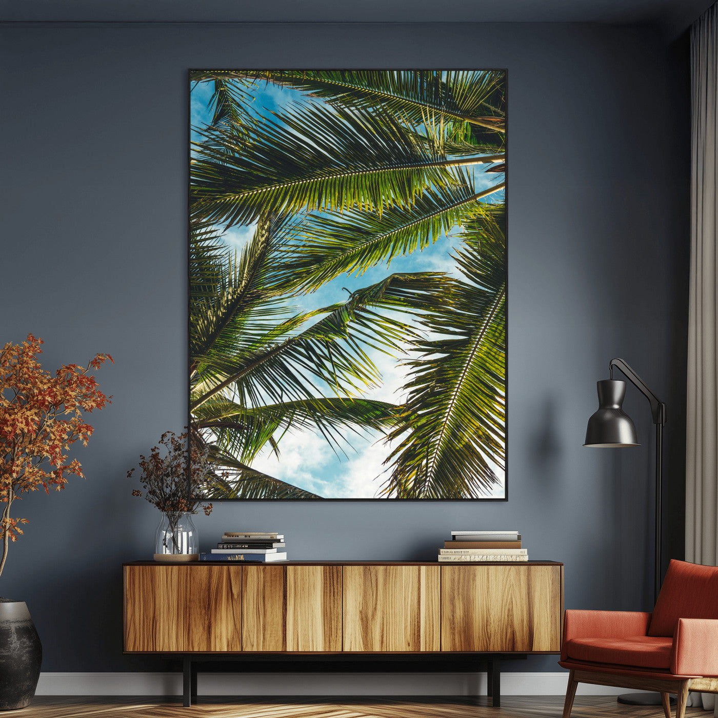 Looking up at lush green palm leaves against a bright blue sky, creating a tropical and relaxing coastal aesthetic.