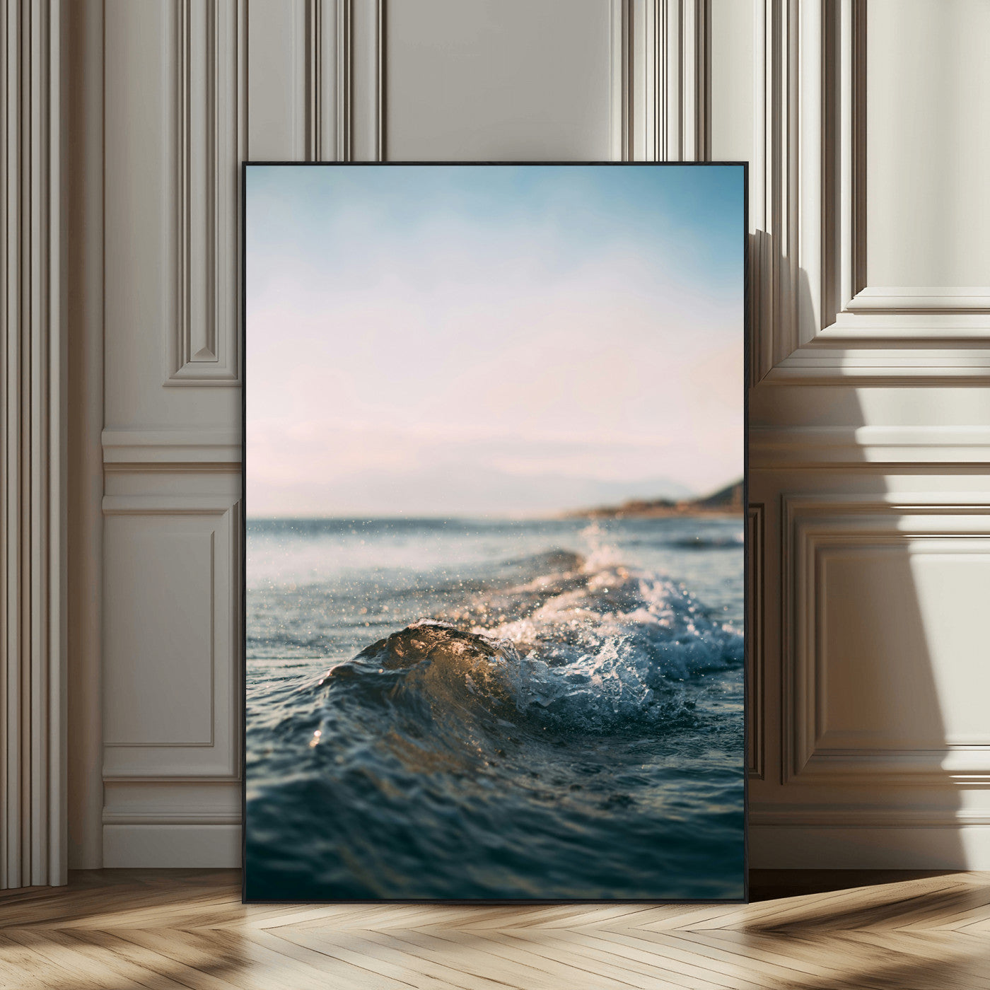 Close-up of ocean waves rolling gently toward the shore at sunset, creating a peaceful and minimalist coastal scene.