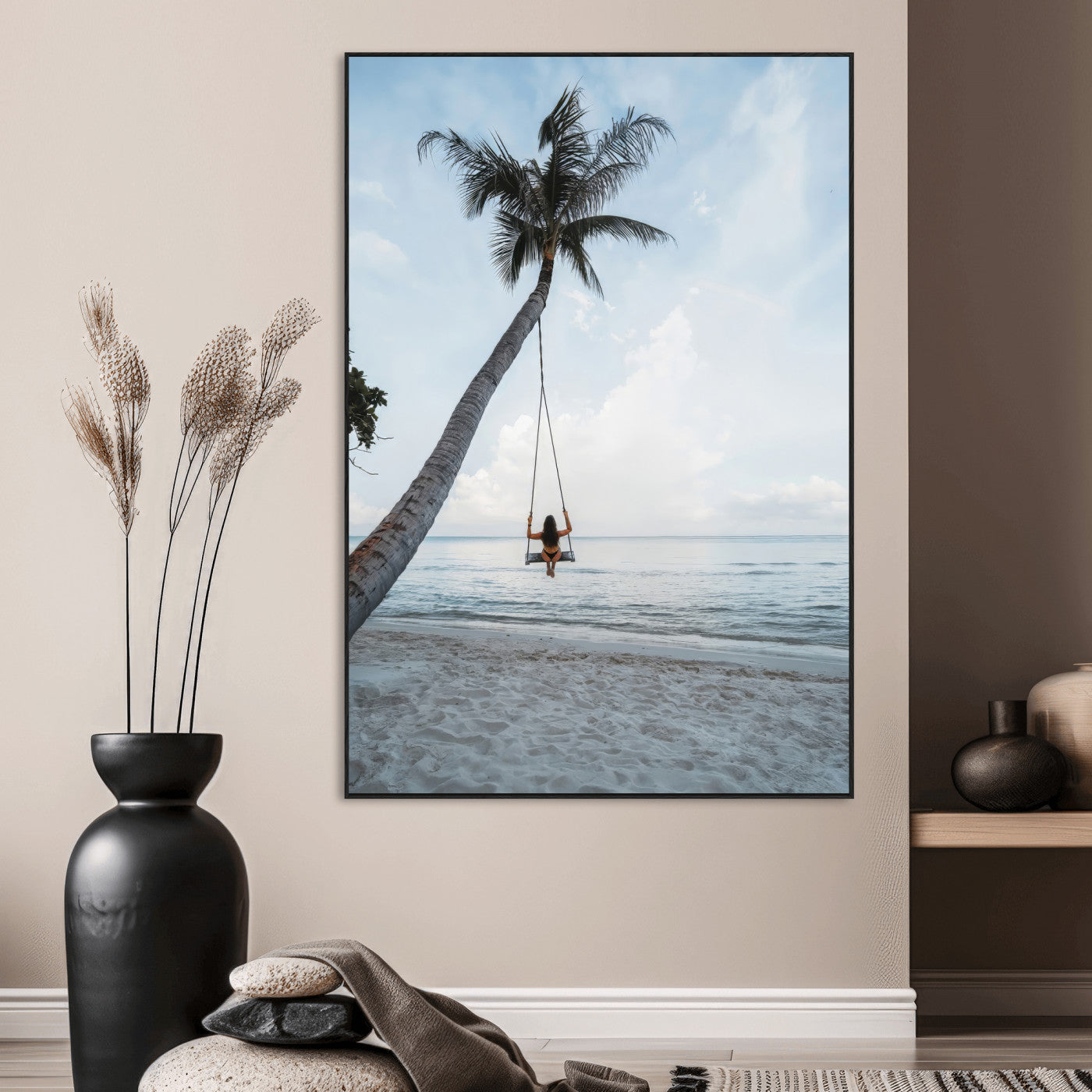 Wall art of a girl on a swing hanging from a palm tree over calm ocean waters, perfect for tropical or minimalist coastal decor.