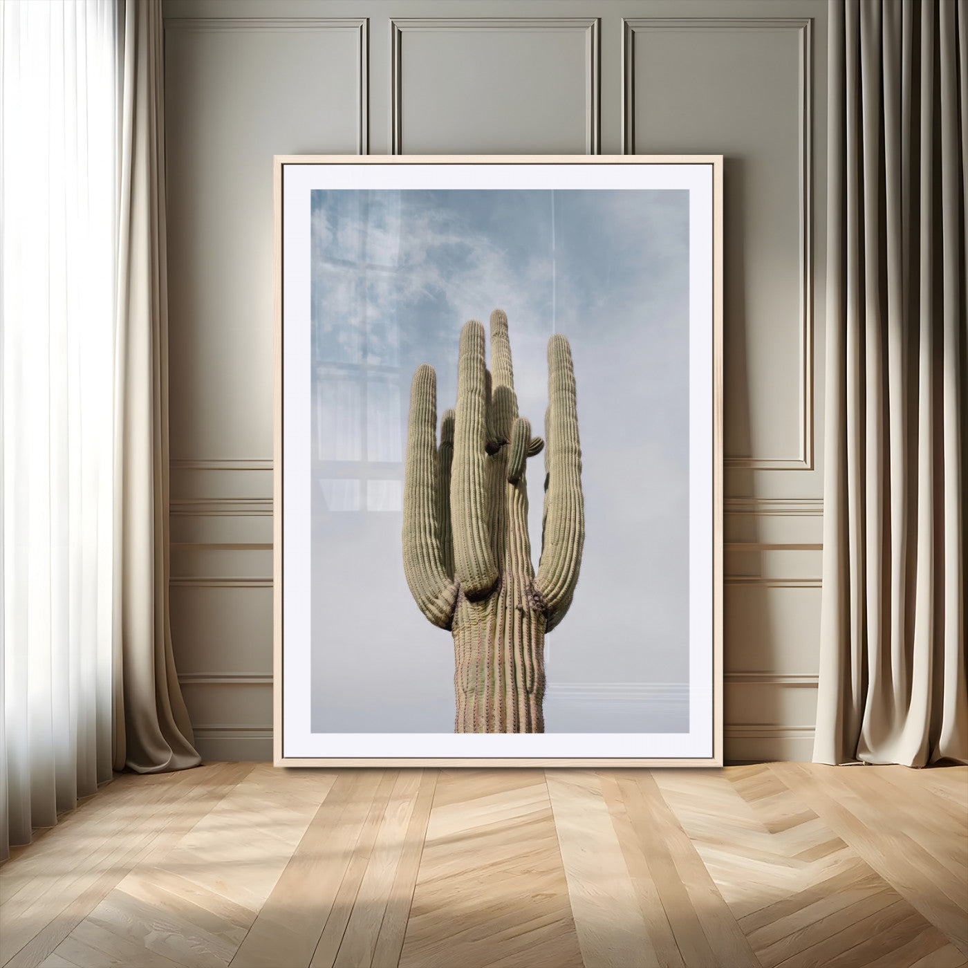 Vertical photo of a tall saguaro cactus against a soft sky, ideal for earthy or Southwestern home decor with warm neutral tones.