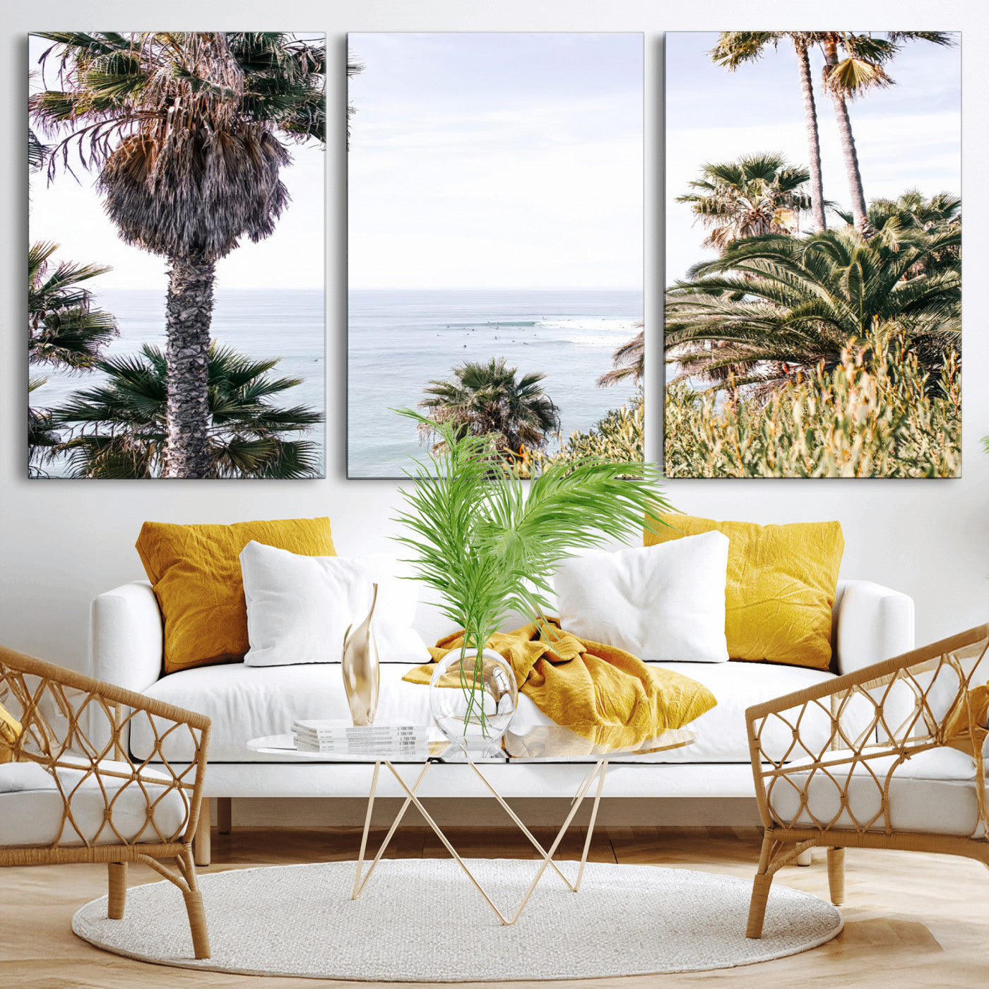 Scenic coastal view with tall palm trees overlooking a calm ocean, soft blue waves, and surfers in the distance, creating a peaceful tropical vibe.
