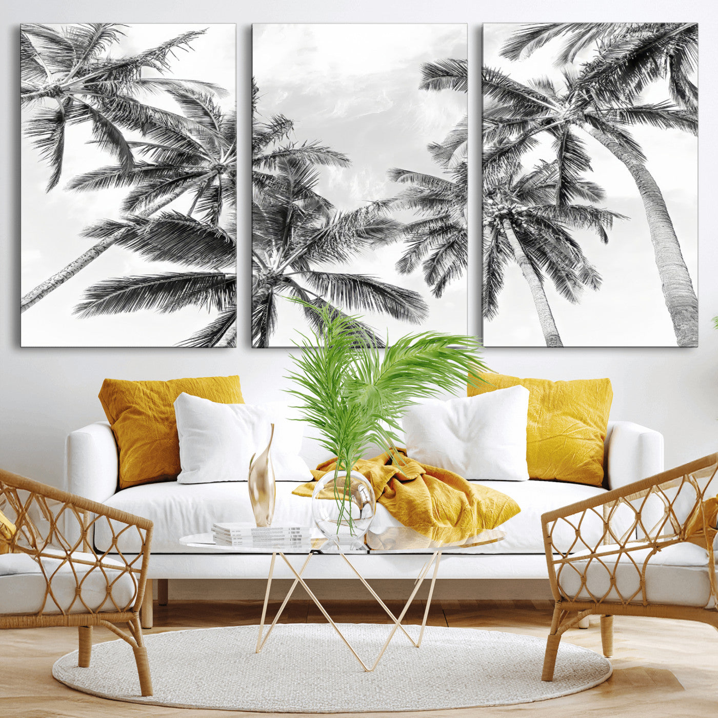 Black and white tropical palm trees viewed from below, swaying gently against a bright sky, creating a serene and elegant coastal atmosphere.