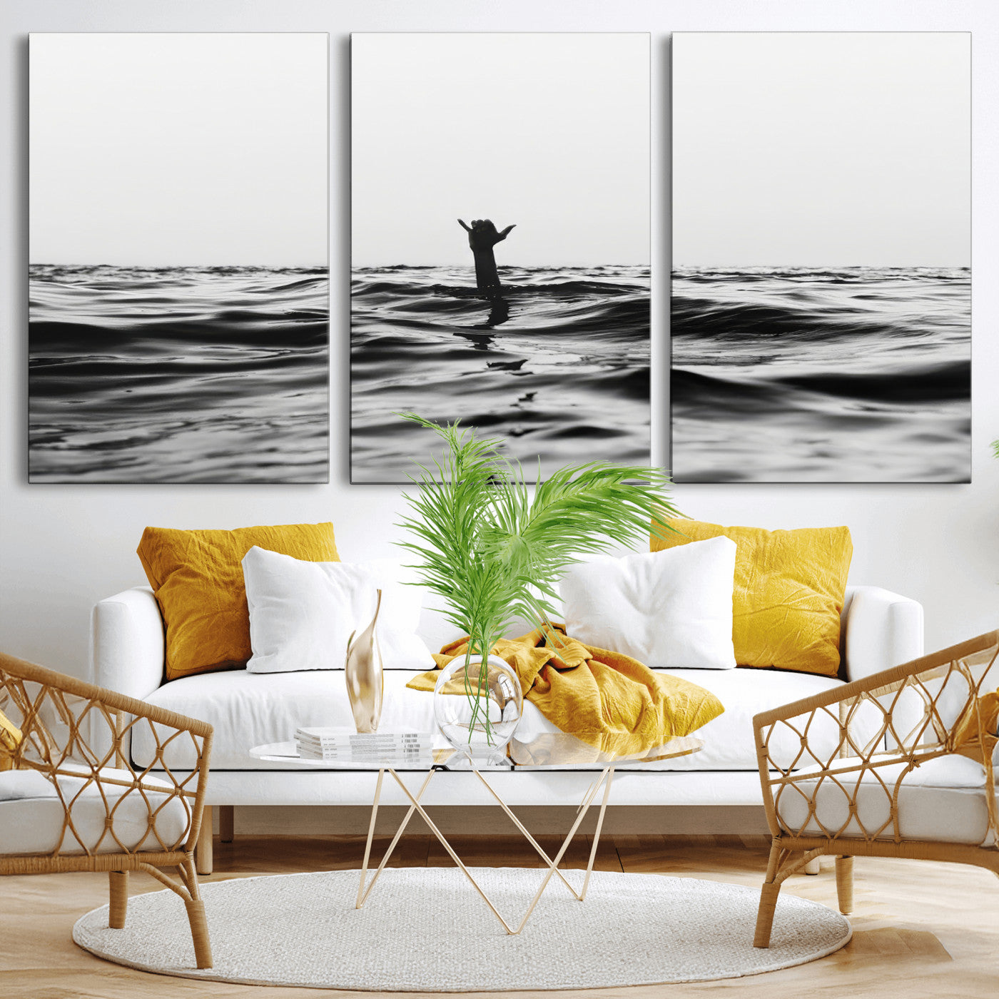 Black and white ocean with a hand making a surfer sign among dark waves, creating a dramatic and minimalist seascape with bold contrast.