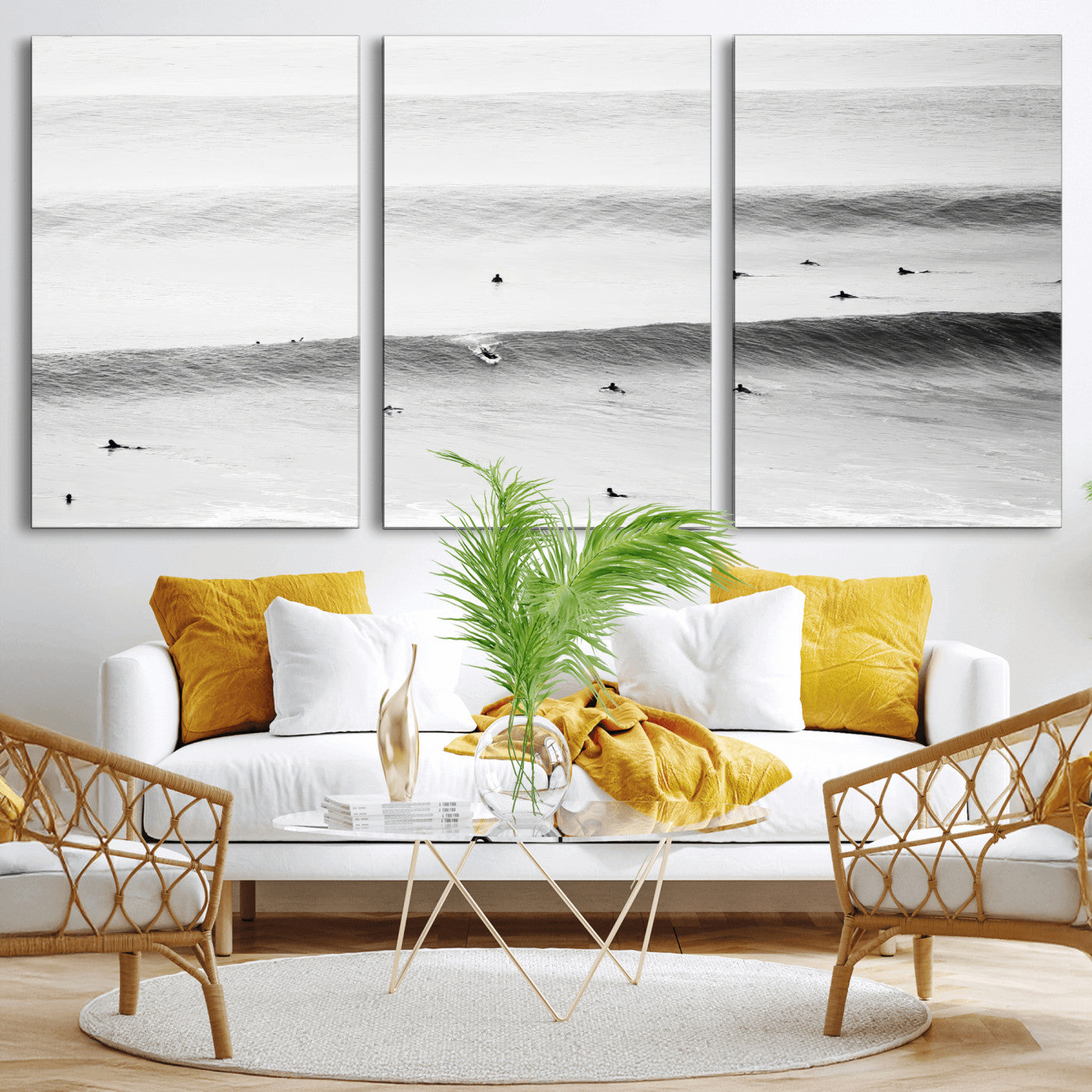 A monochrome photograph of swimmers gliding through gentle ocean waves, evoking a sense of calm and movement.