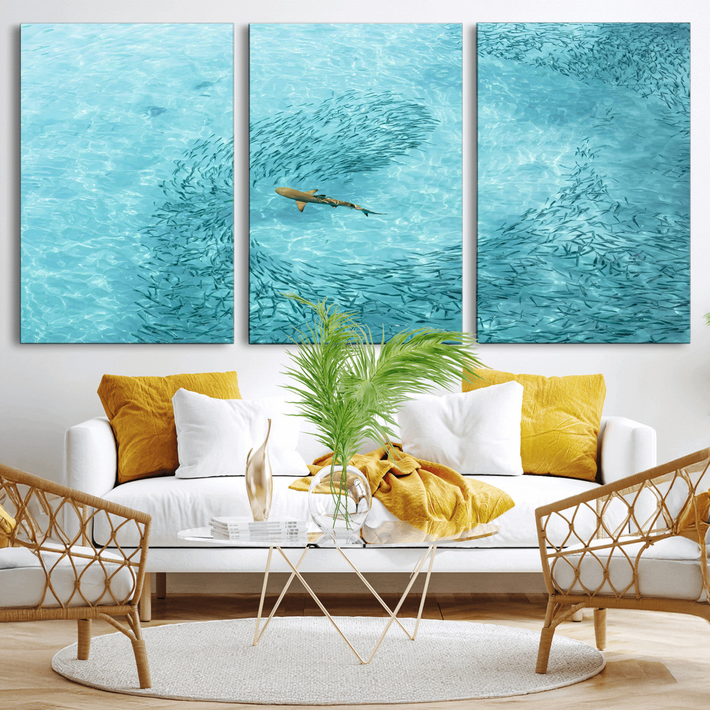 Aerial view of a shark swimming through a swirl of fish in clear turquoise waters, perfect for calm coastal or beach house decor.