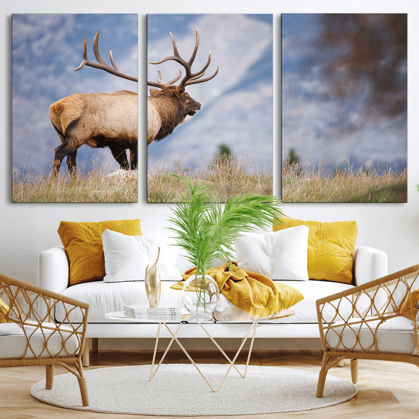 Elk with antlers standing on grass with mountain background, ideal for rustic, cabin, or lodge-inspired wall decor.