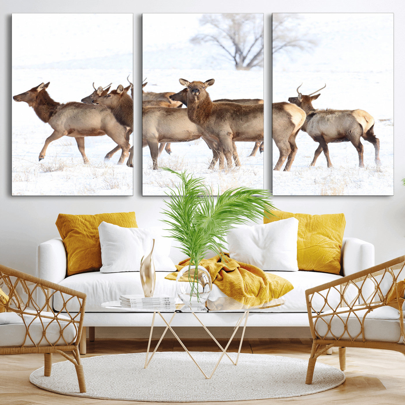 A group of elk standing on snowy terrain with a tree in the background, perfect for rustic or lodge-style winter wall decor.