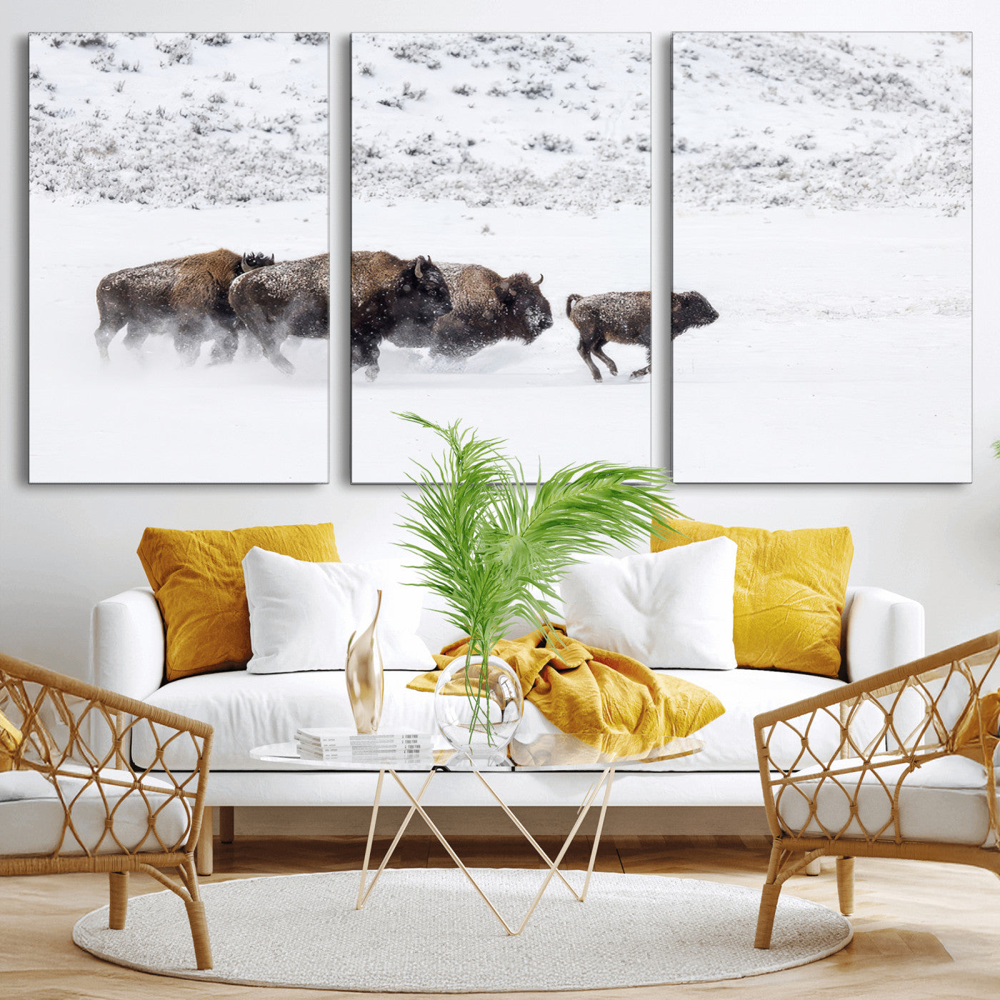 Bison herd running through a snowy open field with mountain backdrop, perfect for rustic or western-themed wall decoration.