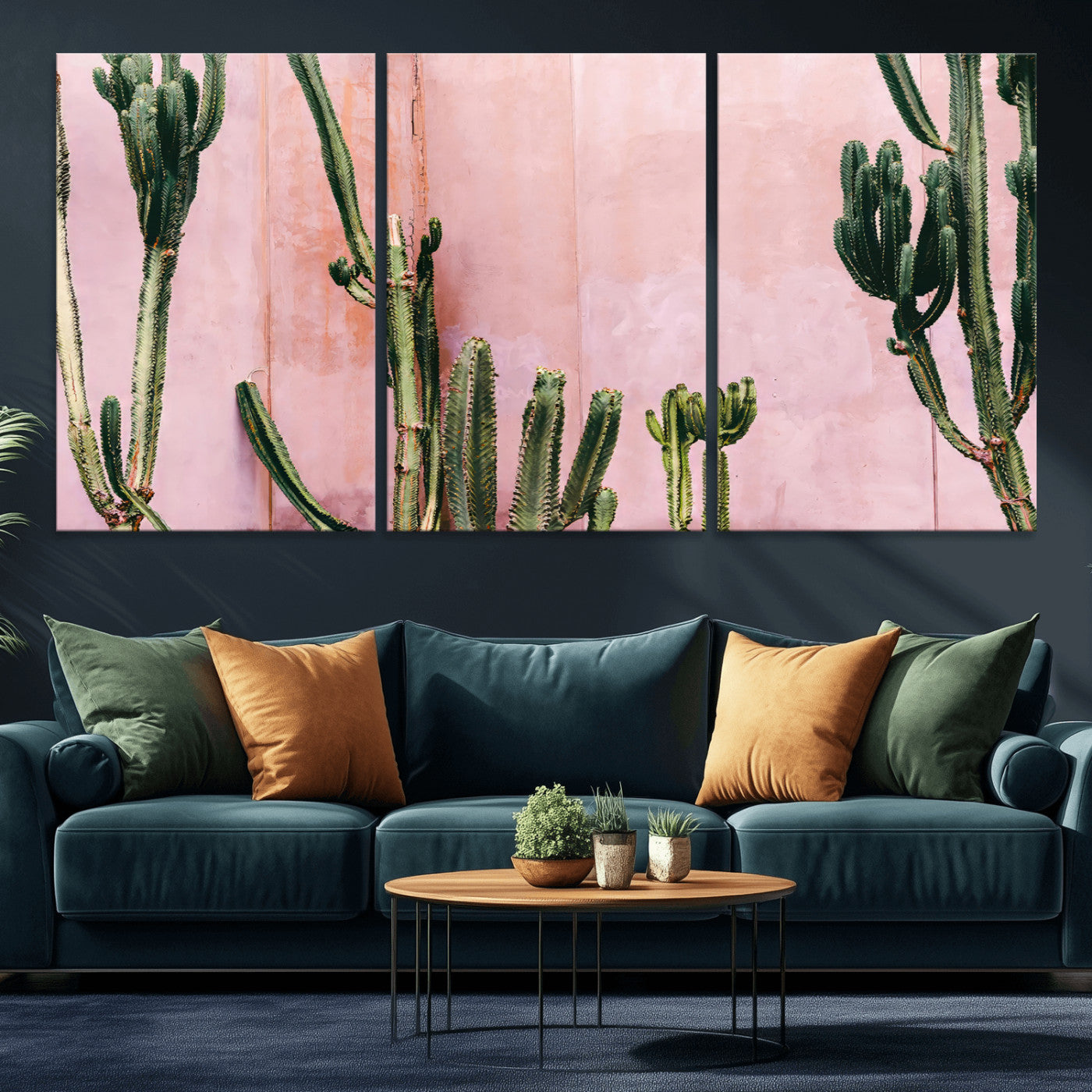 Framed canvas of tall green cacti against a soft pink wall, ideal for modern desert or colorful southwest-inspired home decor.
