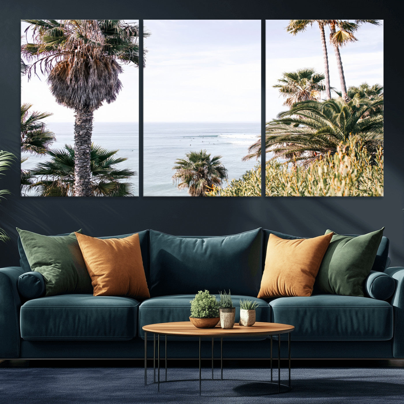 Scenic coastal view with tall palm trees overlooking a calm ocean, soft blue waves, and surfers in the distance, creating a peaceful tropical vibe.