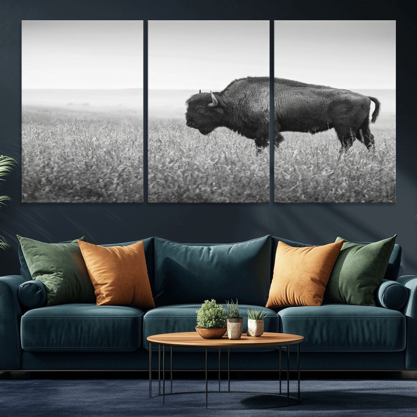 A black and white photograph of a majestic bison standing in a vast grassy prairie, evoking a sense of wilderness and strength.