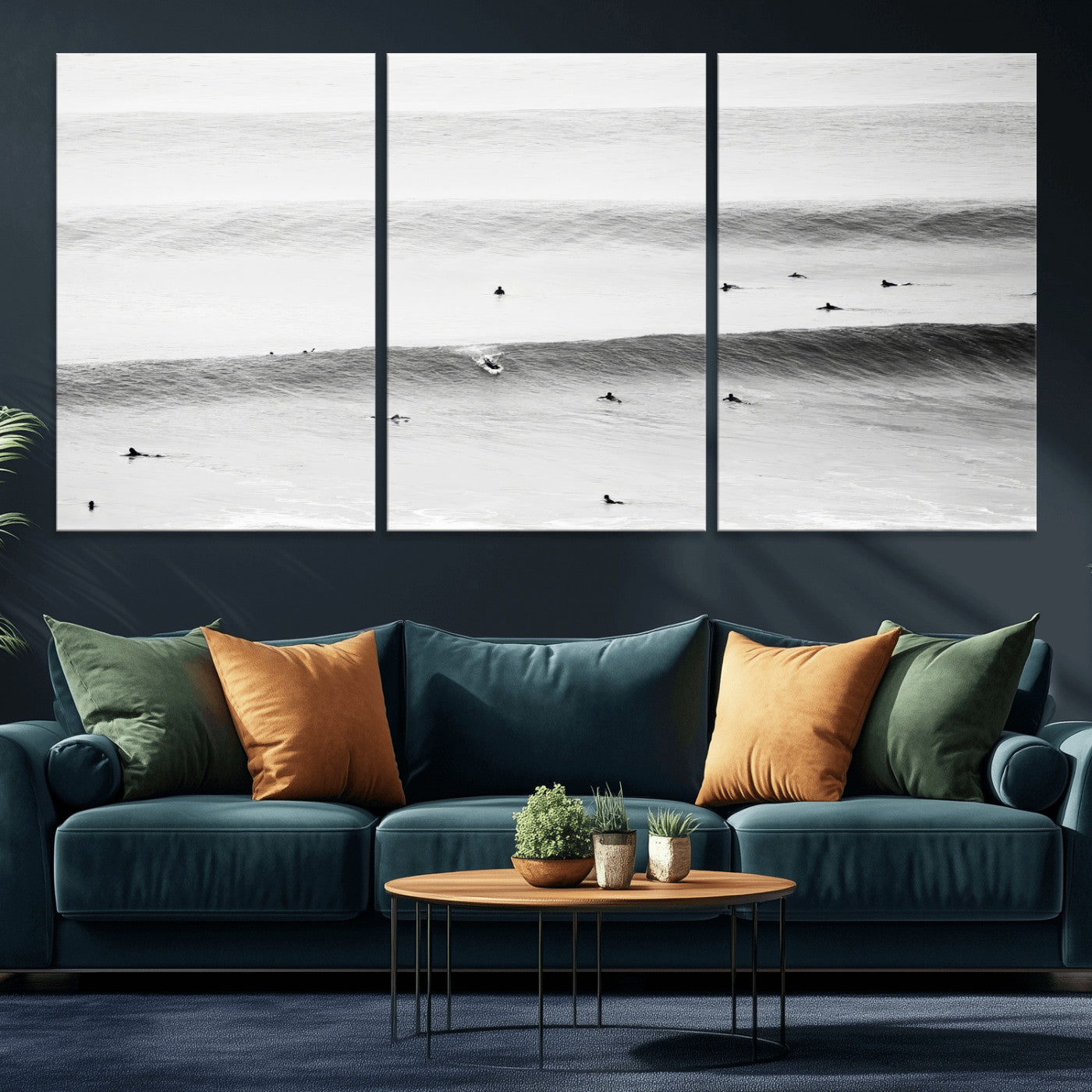 A monochrome photograph of swimmers gliding through gentle ocean waves, evoking a sense of calm and movement.