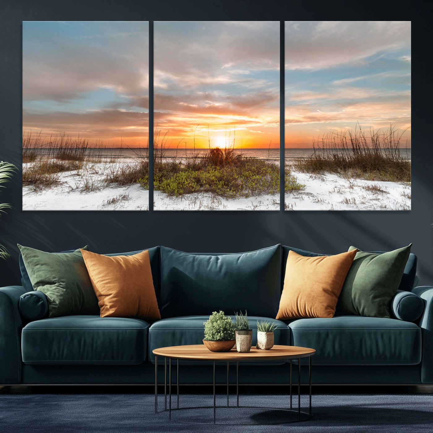 A tranquil beach scene featuring golden sunset hues over the water, with grasses in the foreground and a peaceful, serene atmosphere.