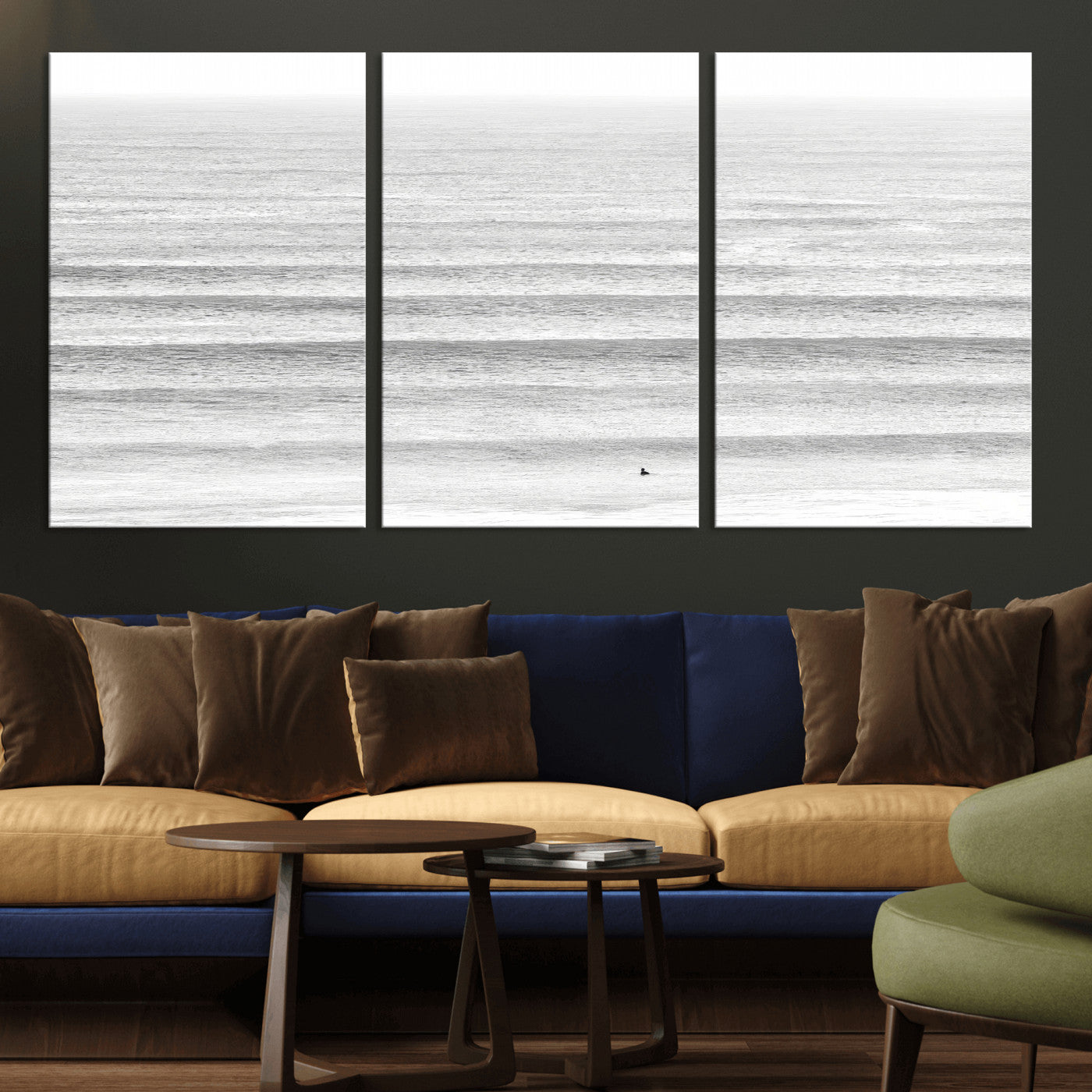 Monochrome photo of a lone surfer in calm layered waves, perfect for minimalist coastal or moody ocean-inspired wall decoration.