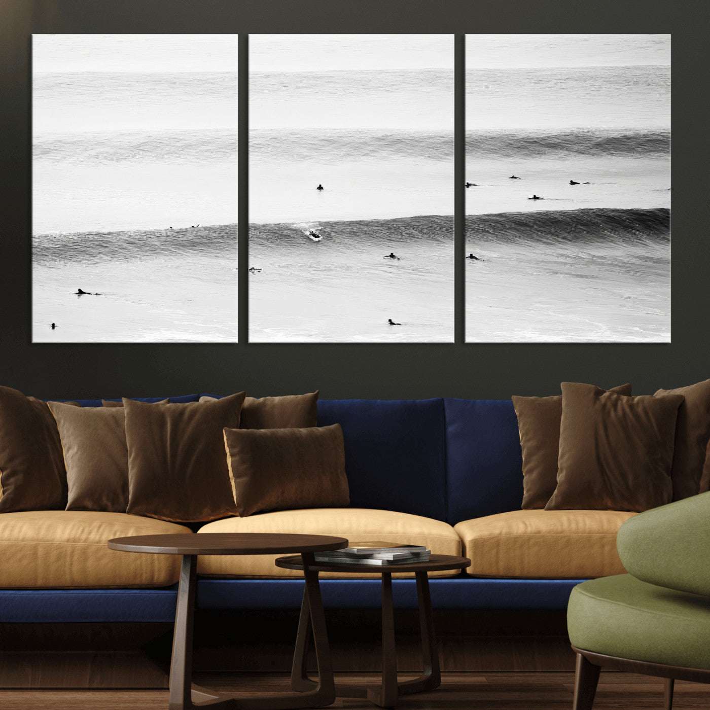 A monochrome photograph of swimmers gliding through gentle ocean waves, evoking a sense of calm and movement.