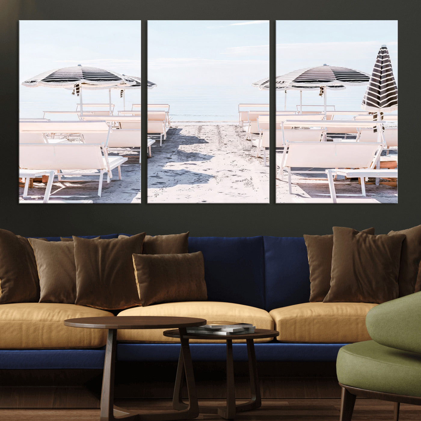 A serene minimalist beach scene featuring striped umbrellas, soft pastel sand, and an elegant lounge setup, creating a tranquil and stylish coastal retreat.