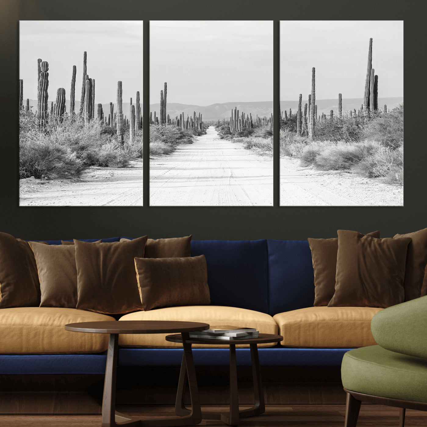 A black and white desert road stretching through a cactus-filled landscape, creating a rugged and timeless southwestern aesthetic with a sense of adventure.