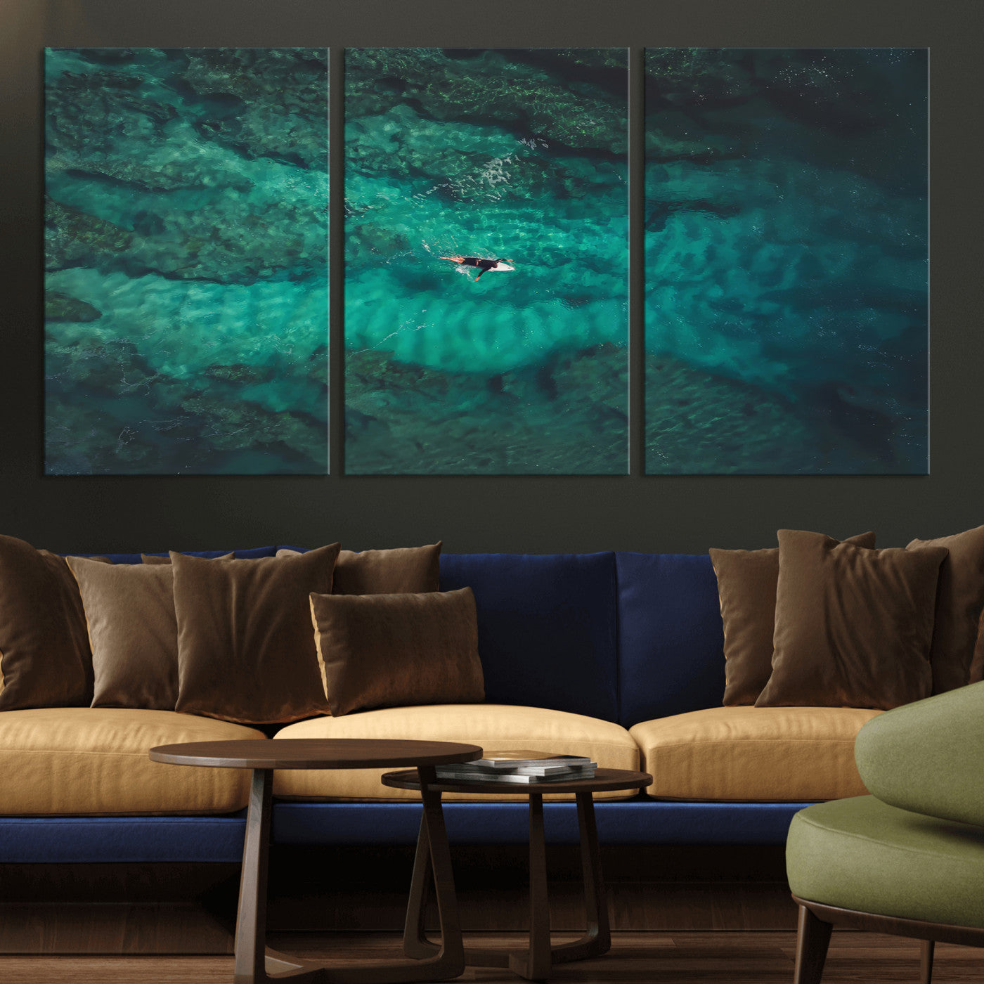 An aerial view of a solo surfer paddling through crystal-clear turquoise waters over a sunlit reef, capturing the beauty and serenity of open water surfing.