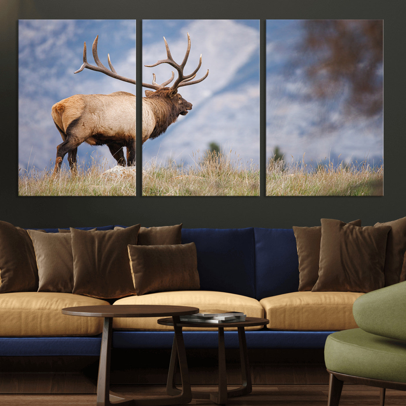 Elk with antlers standing on grass with mountain background, ideal for rustic, cabin, or lodge-inspired wall decor.