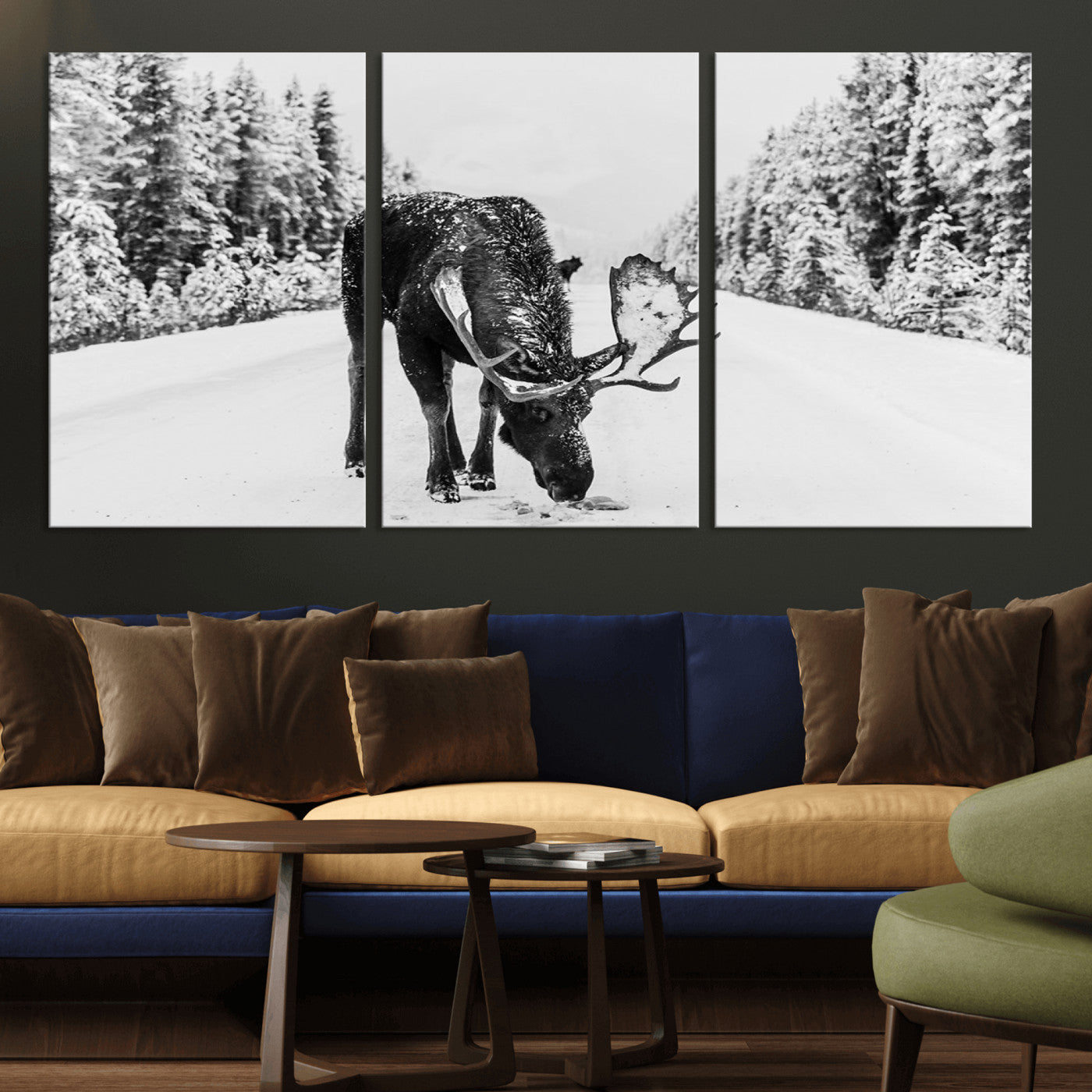 A majestic moose grazing in the snow-covered wilderness, surrounded by snow-covered trees, creating a peaceful winter scene.