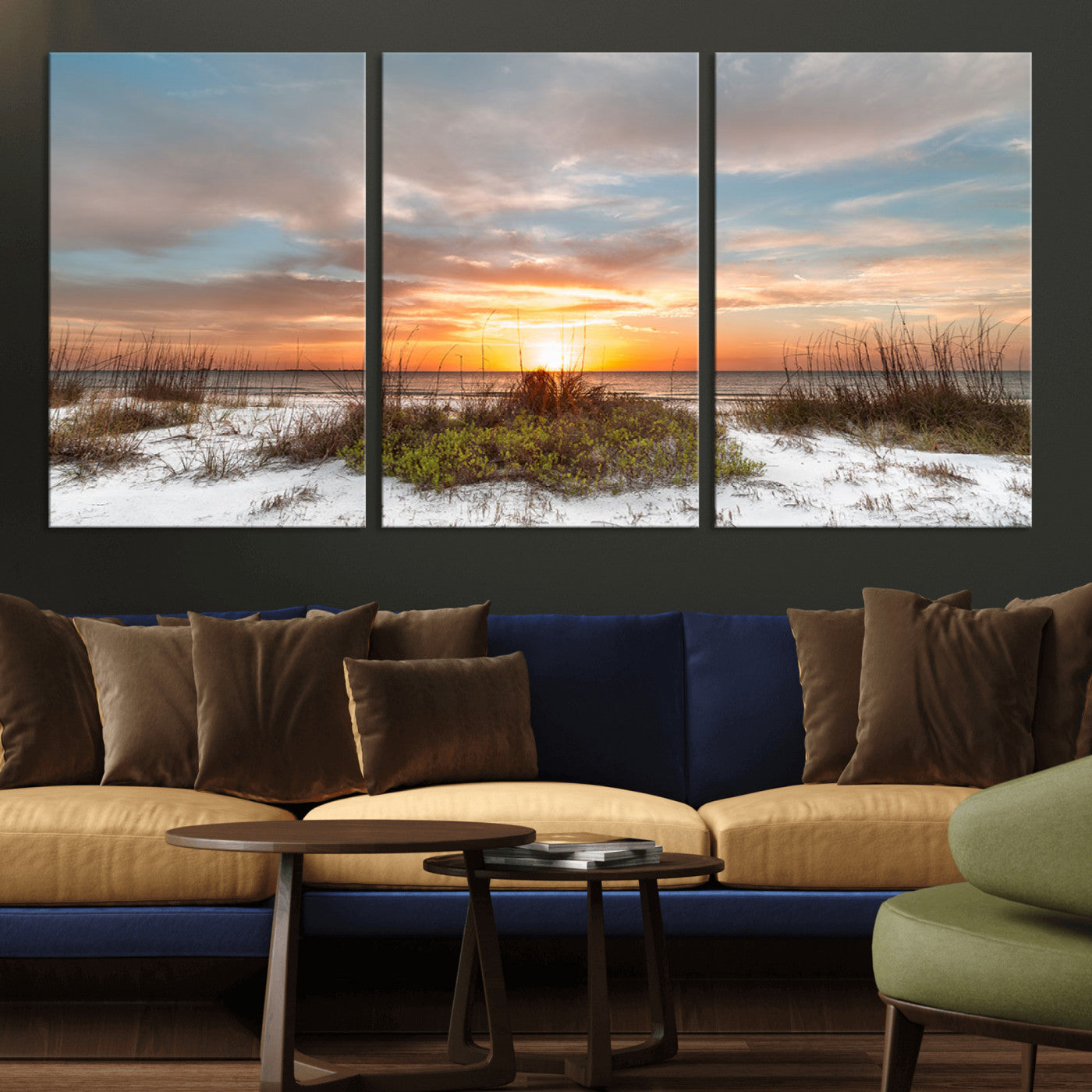 A tranquil beach scene featuring golden sunset hues over the water, with grasses in the foreground and a peaceful, serene atmosphere.