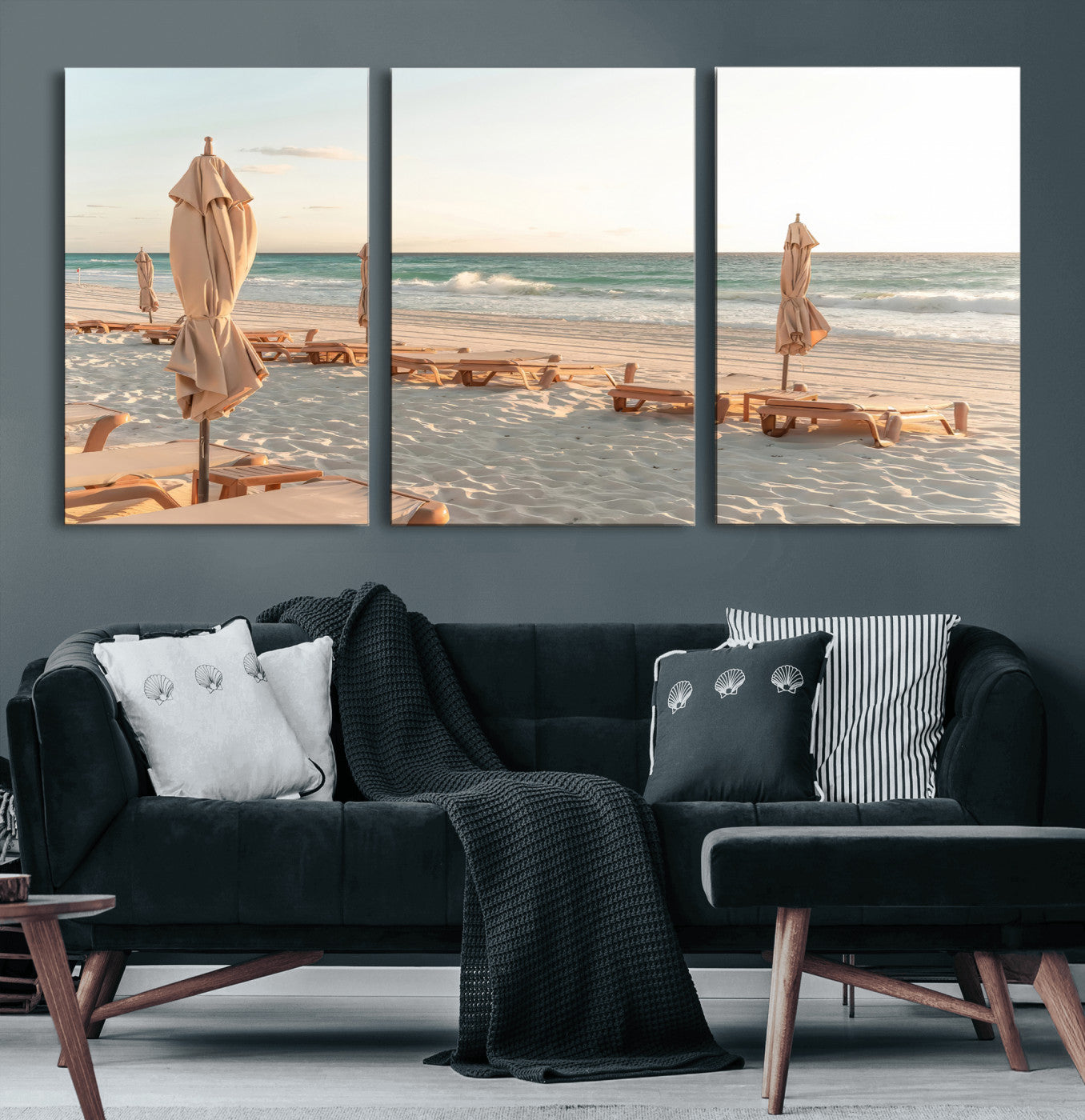 Minimalist photo of empty beach loungers and umbrellas on soft sand, ideal for calm seaside or pastel coastal-style home decor.