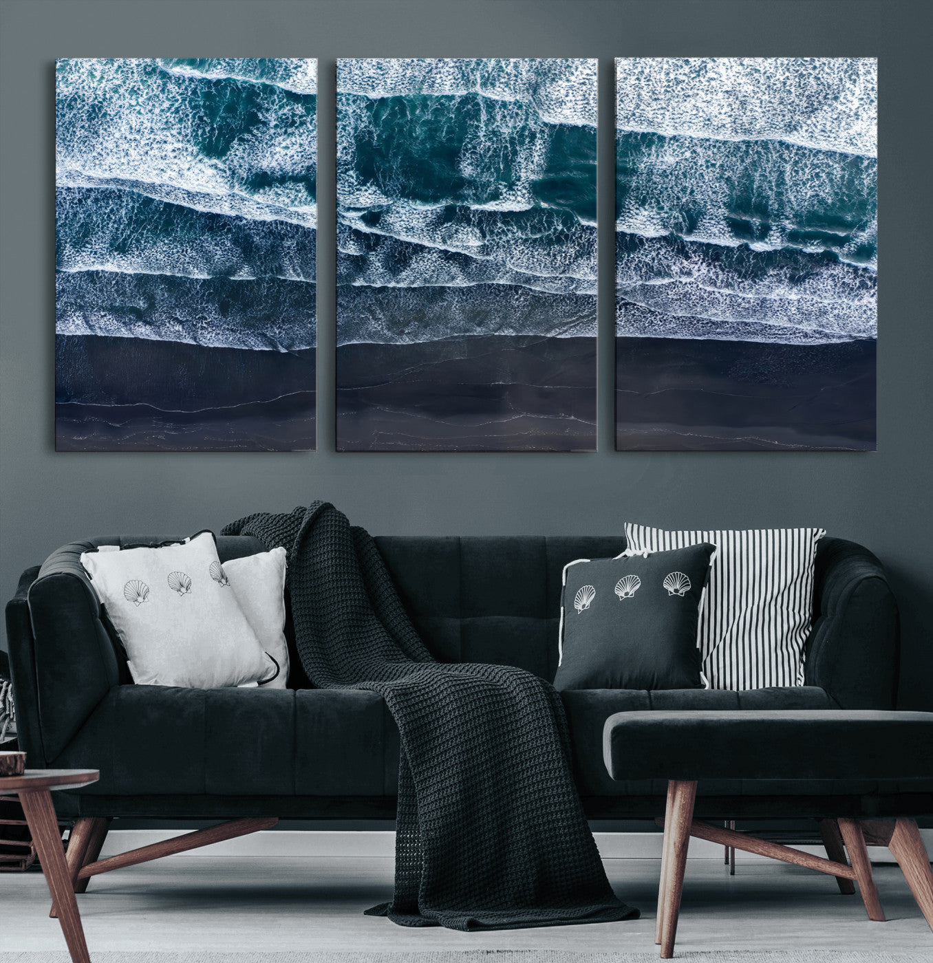 Canvas of aerial ocean waves crashing onto a black sand beach in moody tones, ideal for modern coastal or minimalist home decor.