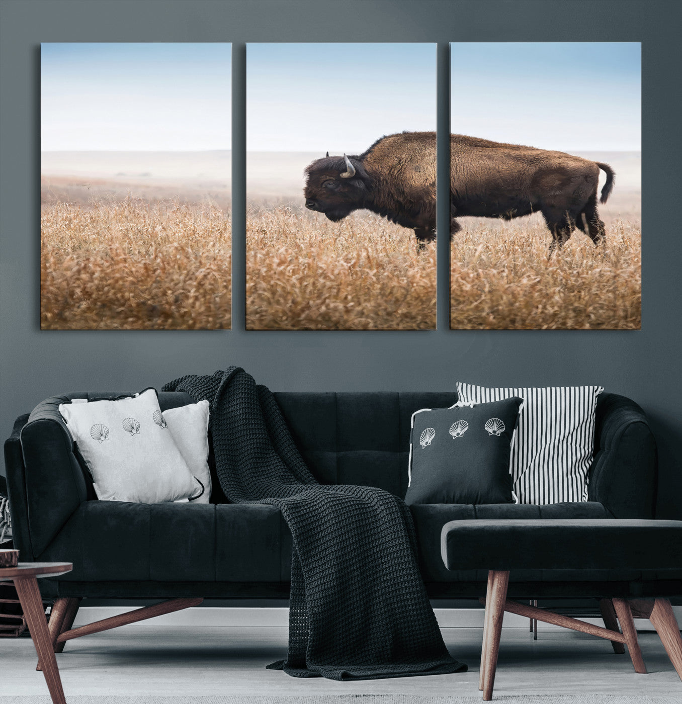 A majestic bison standing in an open prairie field, its strong form blending into the golden grass under a vast blue sky, evoking the wild spirit of the American plains.