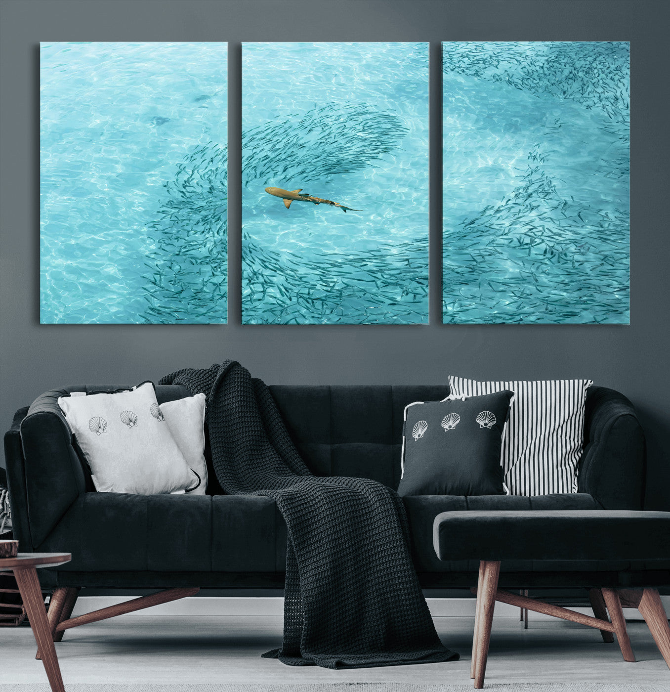 Aerial view of a shark swimming through a swirl of fish in clear turquoise waters, perfect for calm coastal or beach house decor.