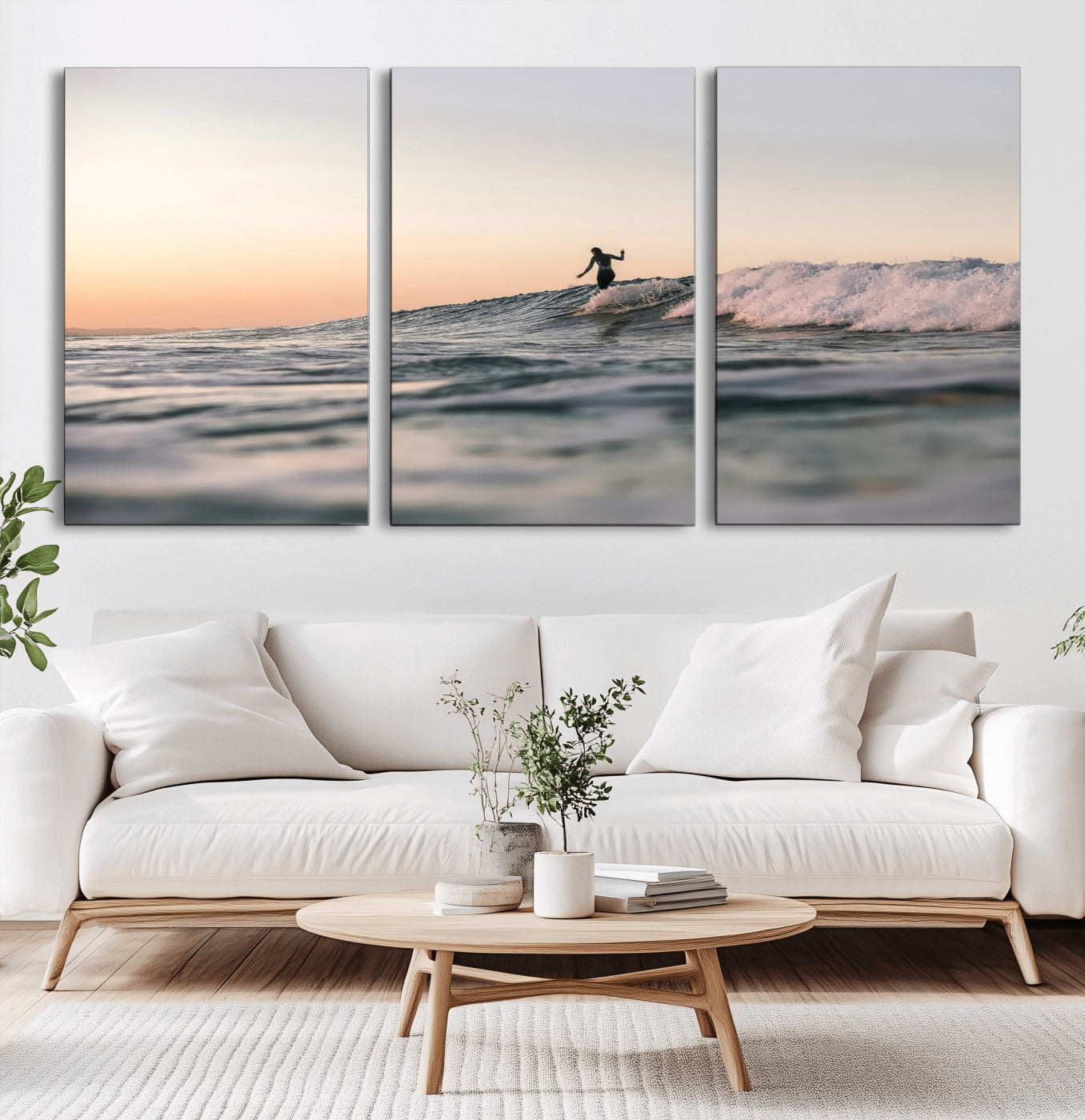 Framed canvas of a female surfer balancing on a wave at sunset, perfect for serene surf or ocean-inspired coastal decor.
