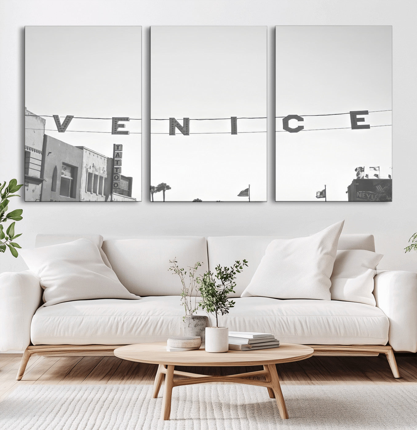 Black and white photo of Venice Beach sign and palm-lined street, perfect for urban coastal or minimalist LA-inspired wall decoration.