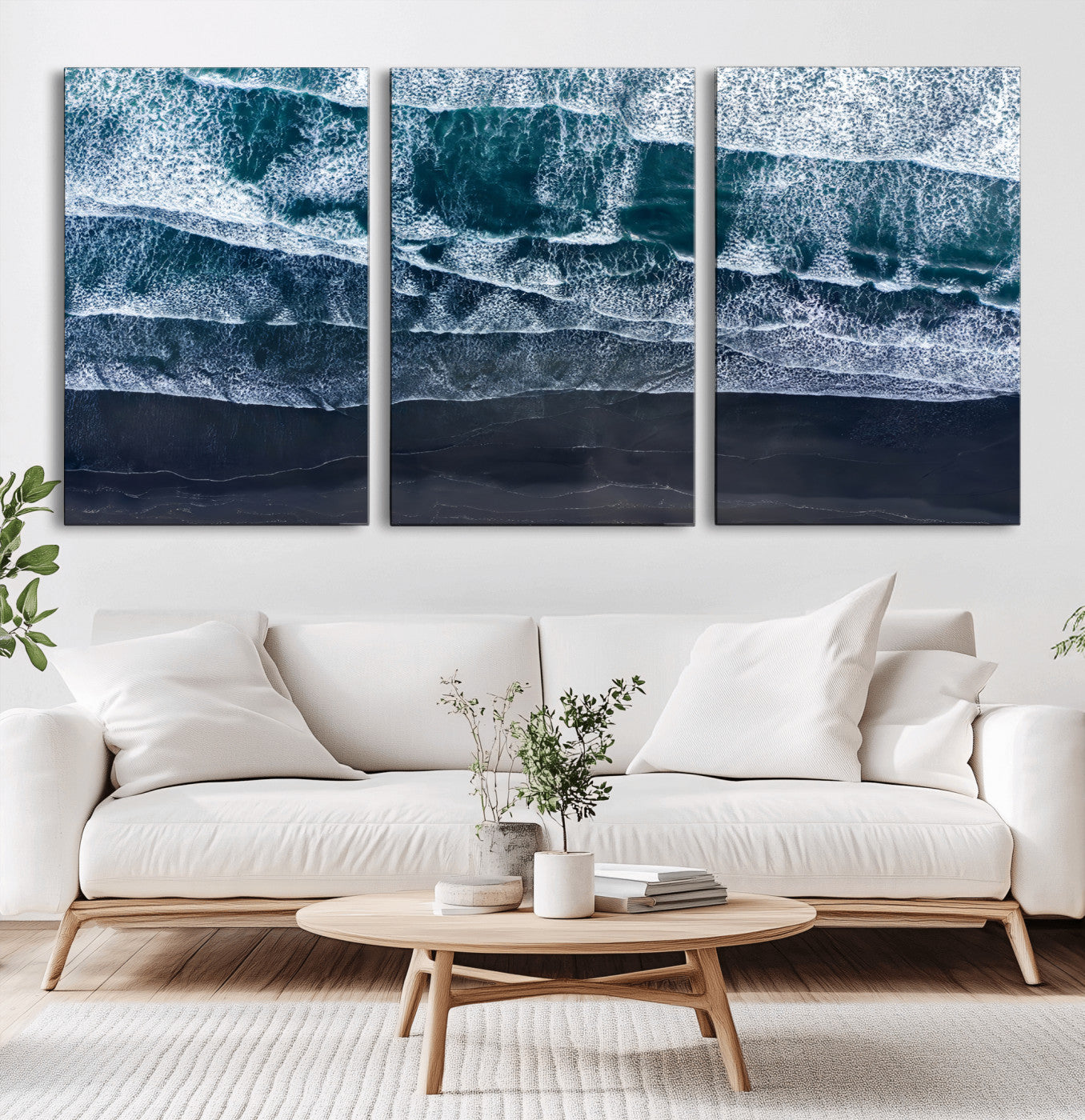 Canvas of aerial ocean waves crashing onto a black sand beach in moody tones, ideal for modern coastal or minimalist home decor.