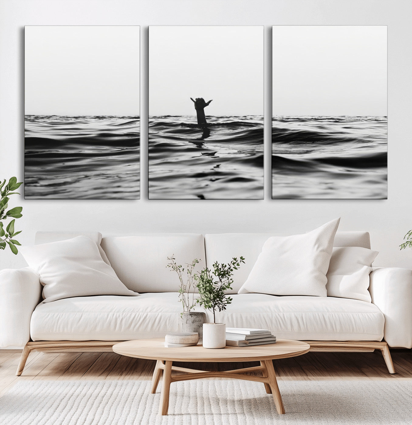 Black and white ocean with a hand making a surfer sign among dark waves, creating a dramatic and minimalist seascape with bold contrast.