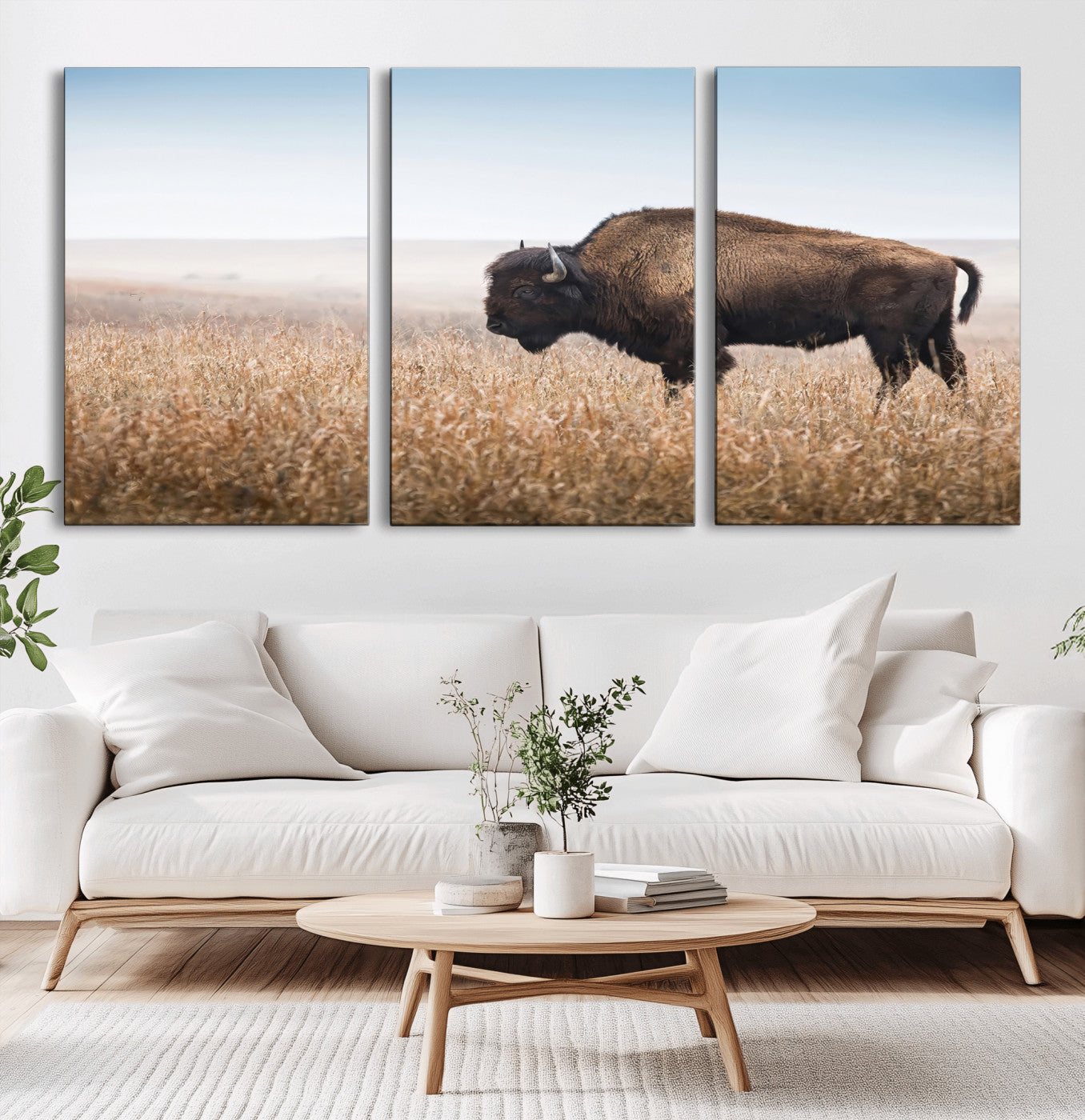 A majestic bison standing in an open prairie field, its strong form blending into the golden grass under a vast blue sky, evoking the wild spirit of the American plains.