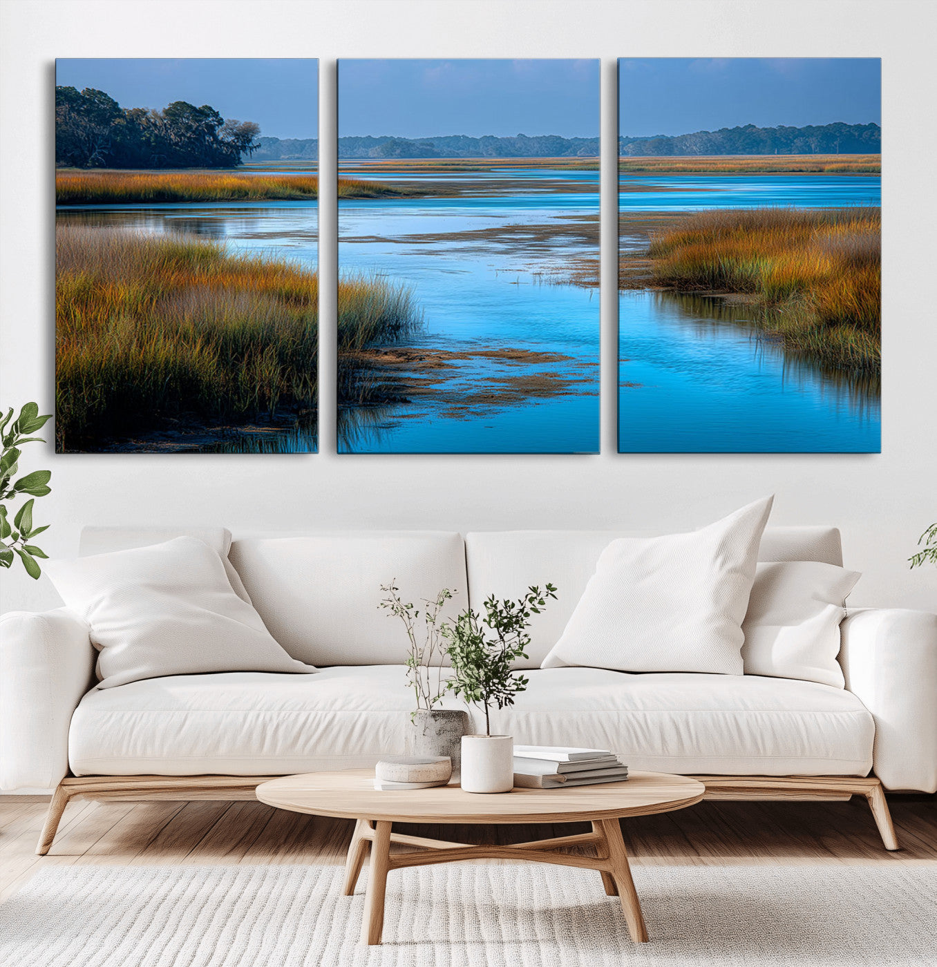 A peaceful marshland scene with calm blue water reflecting the surrounding grasses and trees, capturing the beauty of nature in a serene landscape.