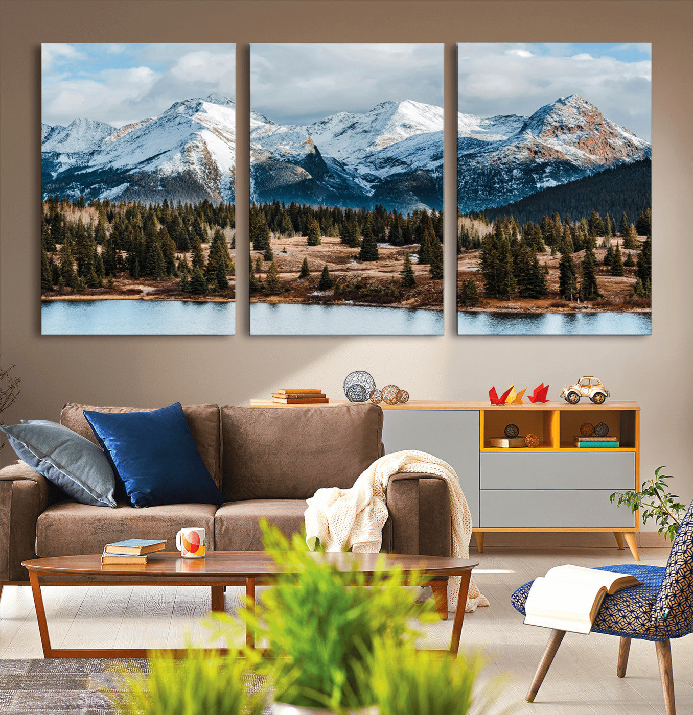 Framed canvas of snowy mountain peaks with pine forest and alpine lake, perfect for winter cabin or wilderness-inspired home decor.