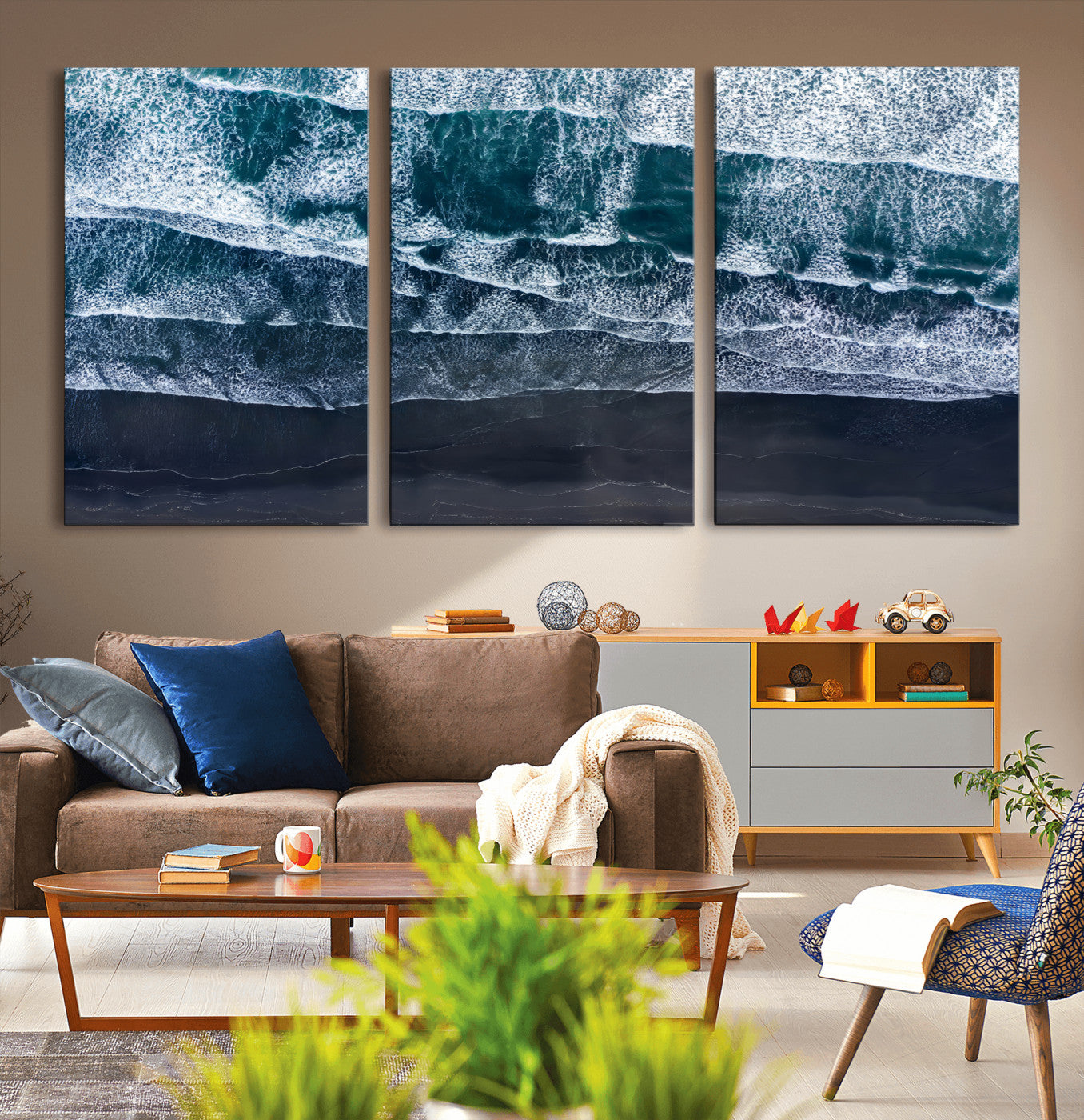 Canvas of aerial ocean waves crashing onto a black sand beach in moody tones, ideal for modern coastal or minimalist home decor.