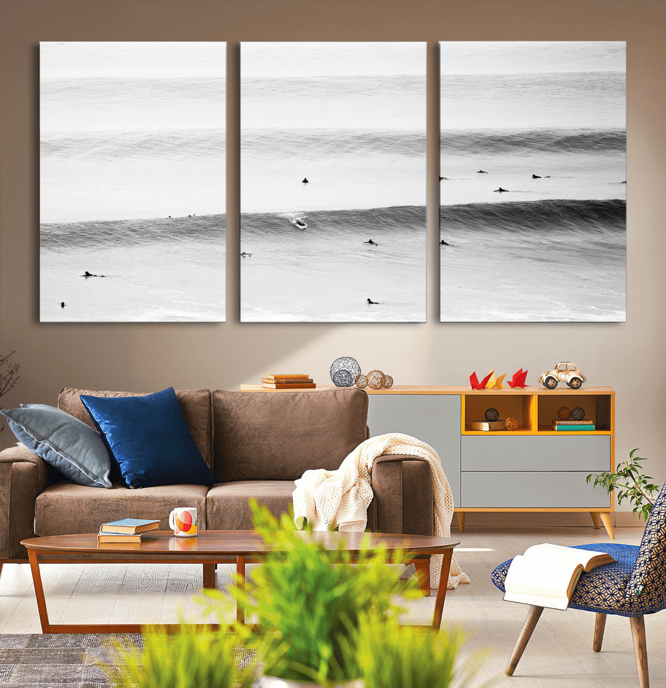 A monochrome photograph of swimmers gliding through gentle ocean waves, evoking a sense of calm and movement.