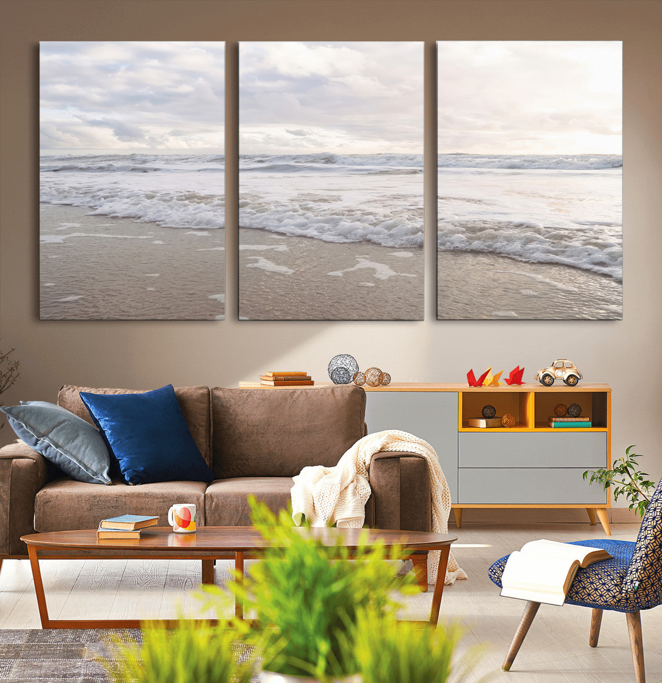 Peaceful ocean waves rolling onto the sandy shore under soft light, perfect for neutral or coastal minimalist decor themes.