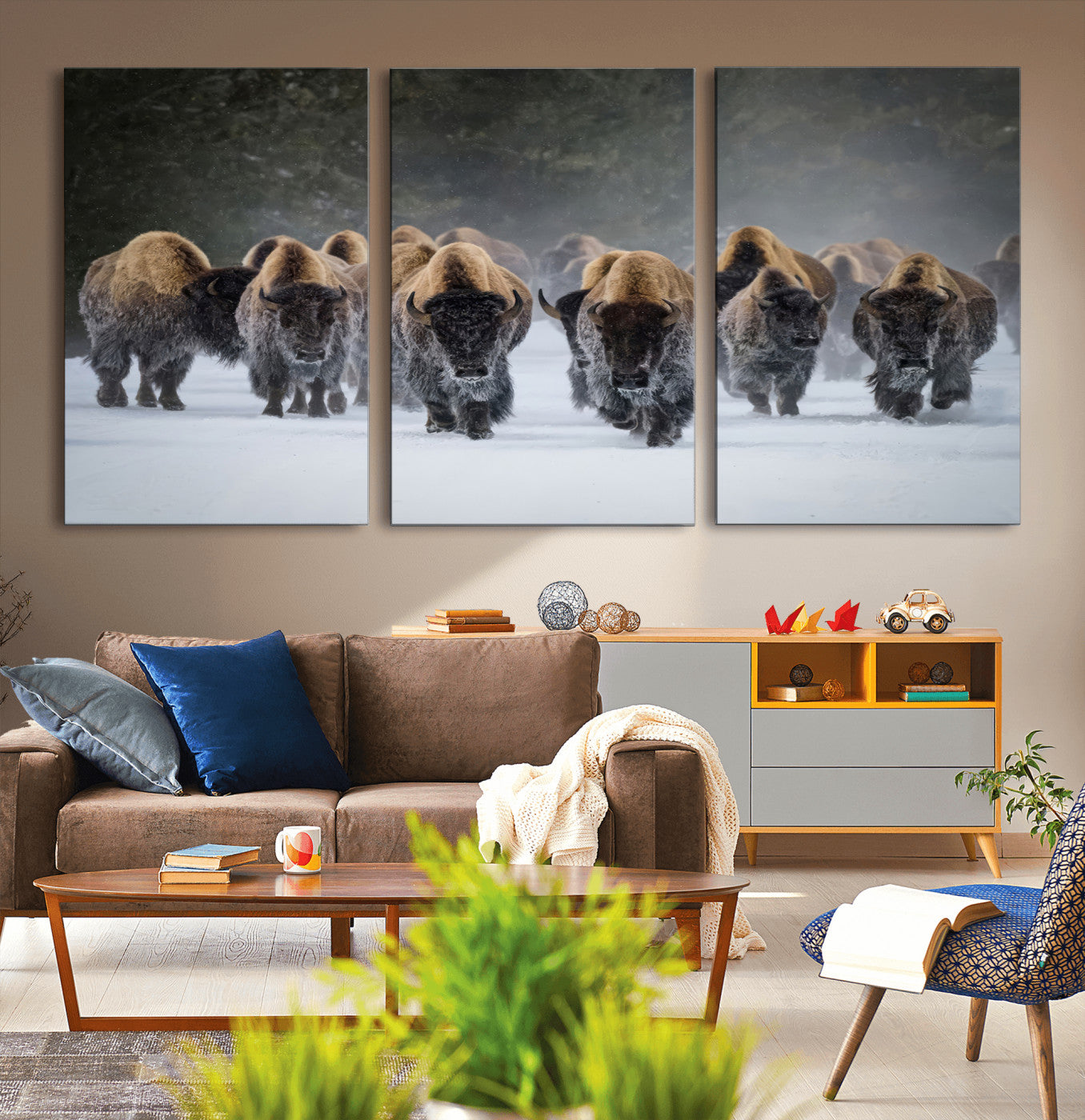 A herd of American bisons walking through deep snow in a forest, evoking a powerful rustic wilderness mood for western-style interiors.