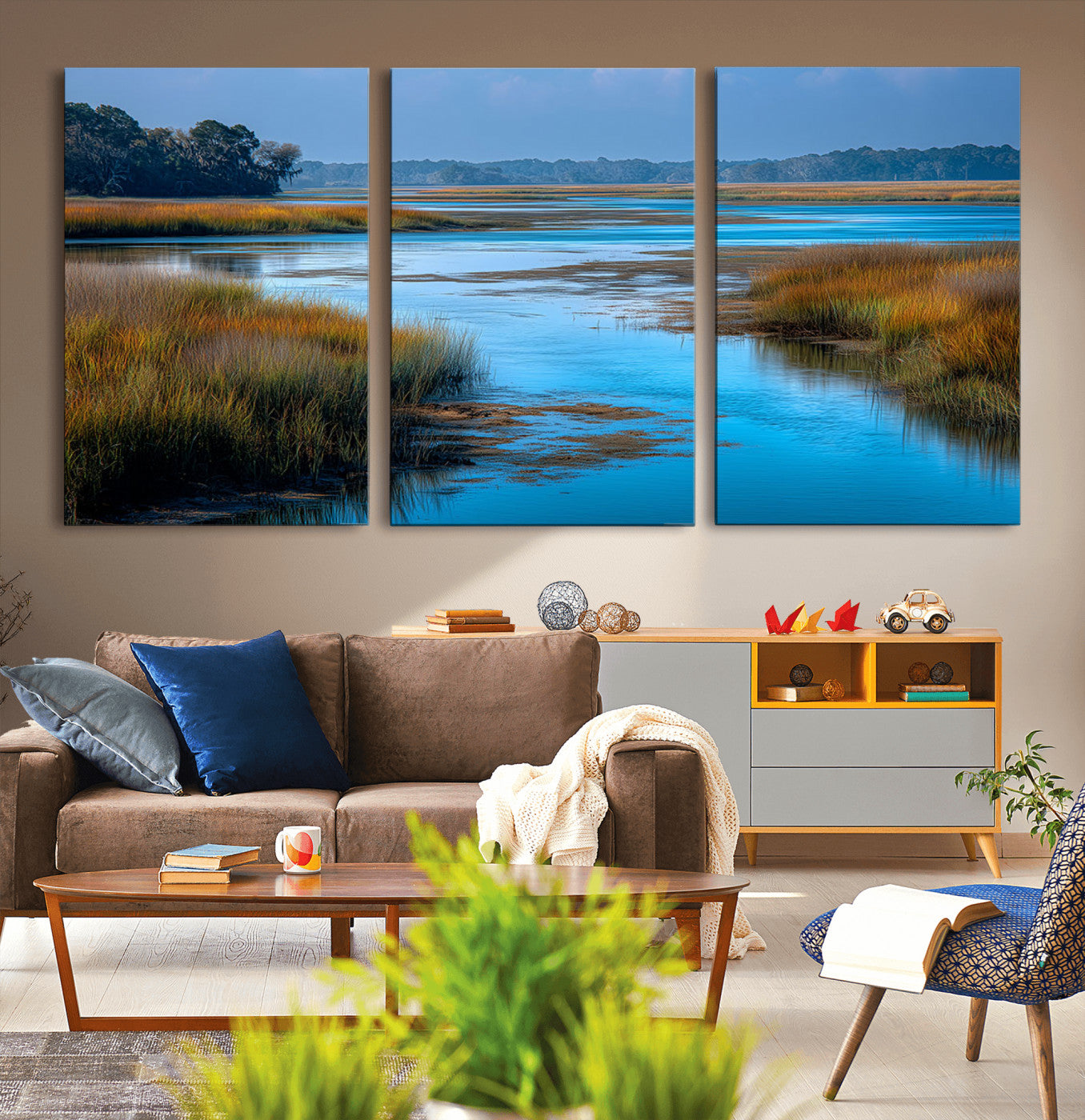 A peaceful marshland scene with calm blue water reflecting the surrounding grasses and trees, capturing the beauty of nature in a serene landscape.