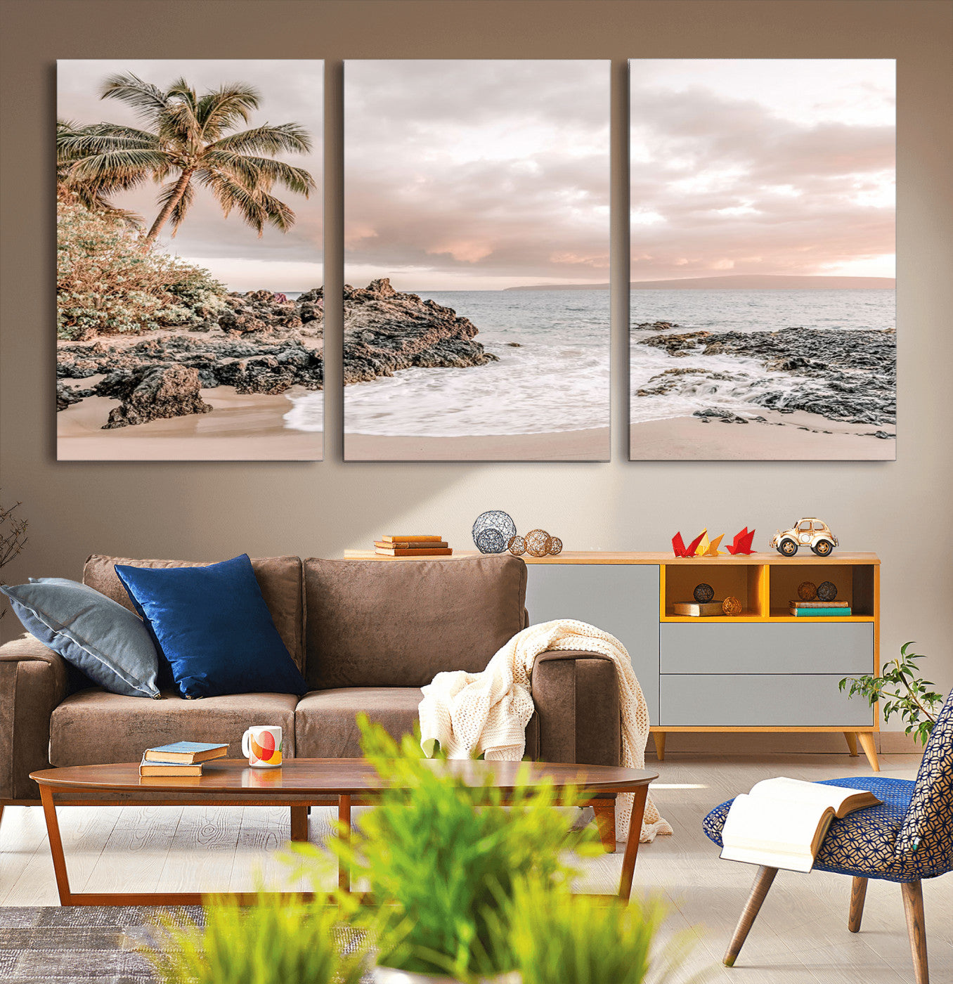 A peaceful beach scene with a palm tree and rocks, soft waves washing onto the shore under a soft pastel sky at sunset.