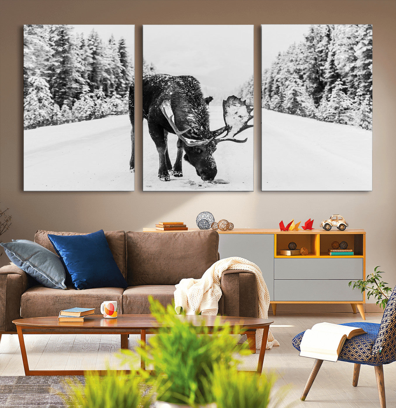 A majestic moose grazing in the snow-covered wilderness, surrounded by snow-covered trees, creating a peaceful winter scene.