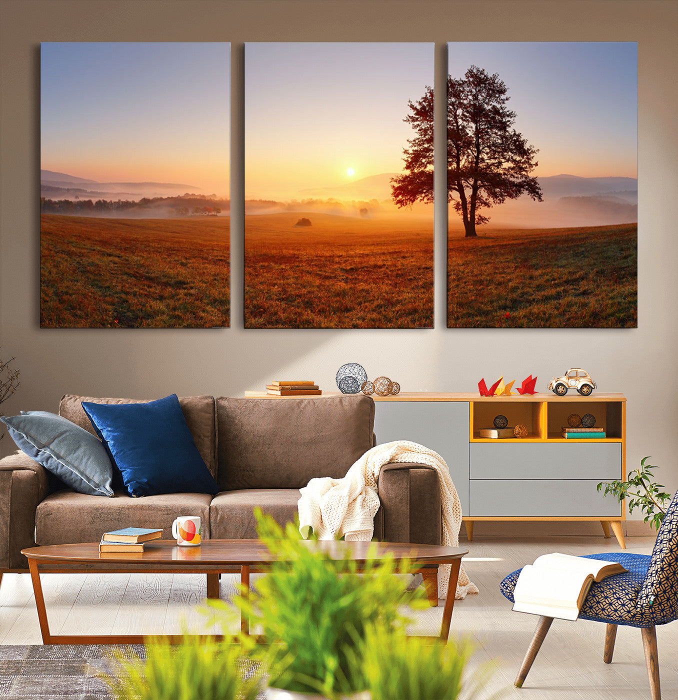 A tranquil landscape at sunrise with a mist-covered field and a lone tree, creating a peaceful and natural atmosphere.